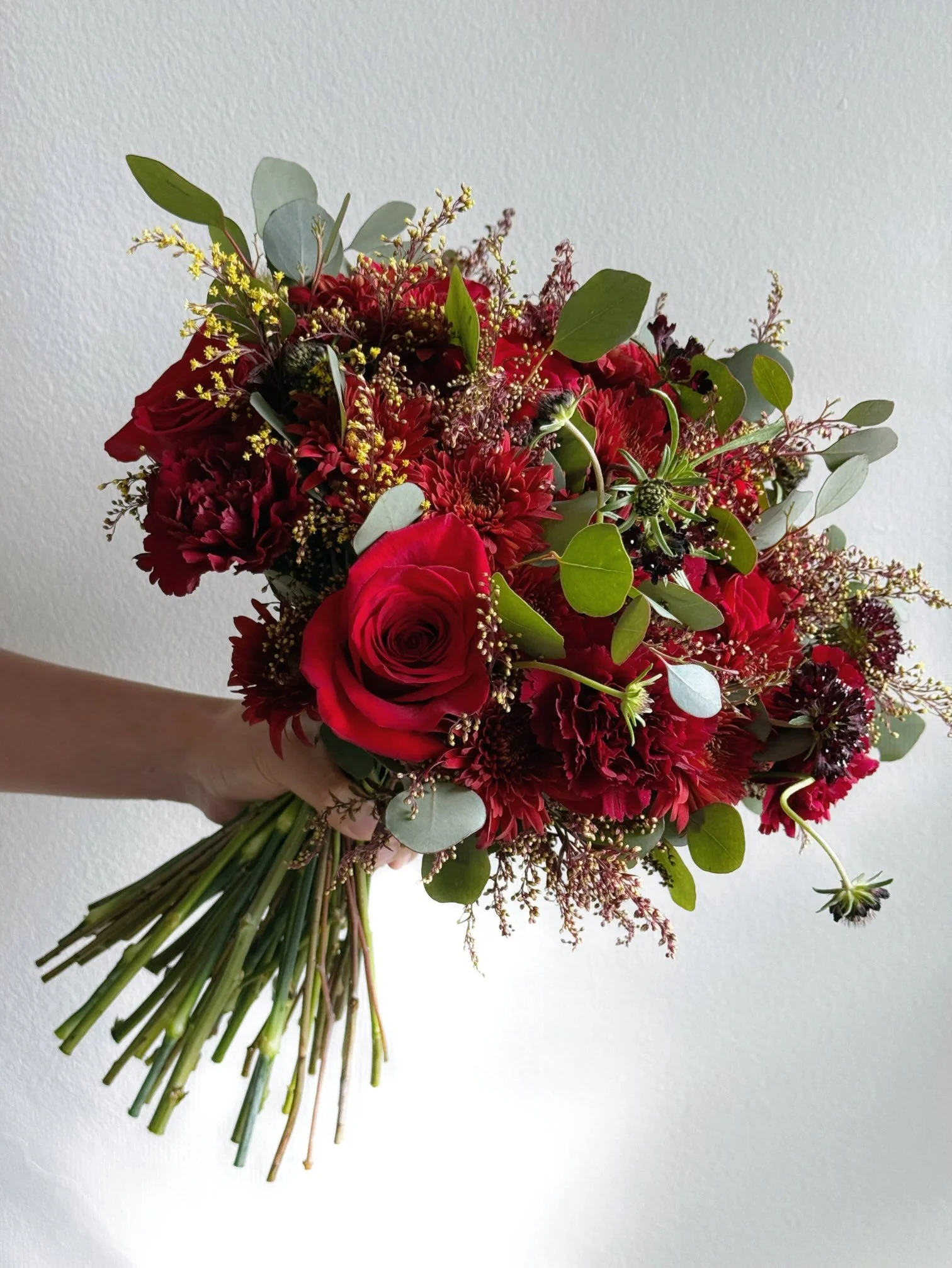 Red rose bouquet with eucalyptus – classic presentation.jpeg