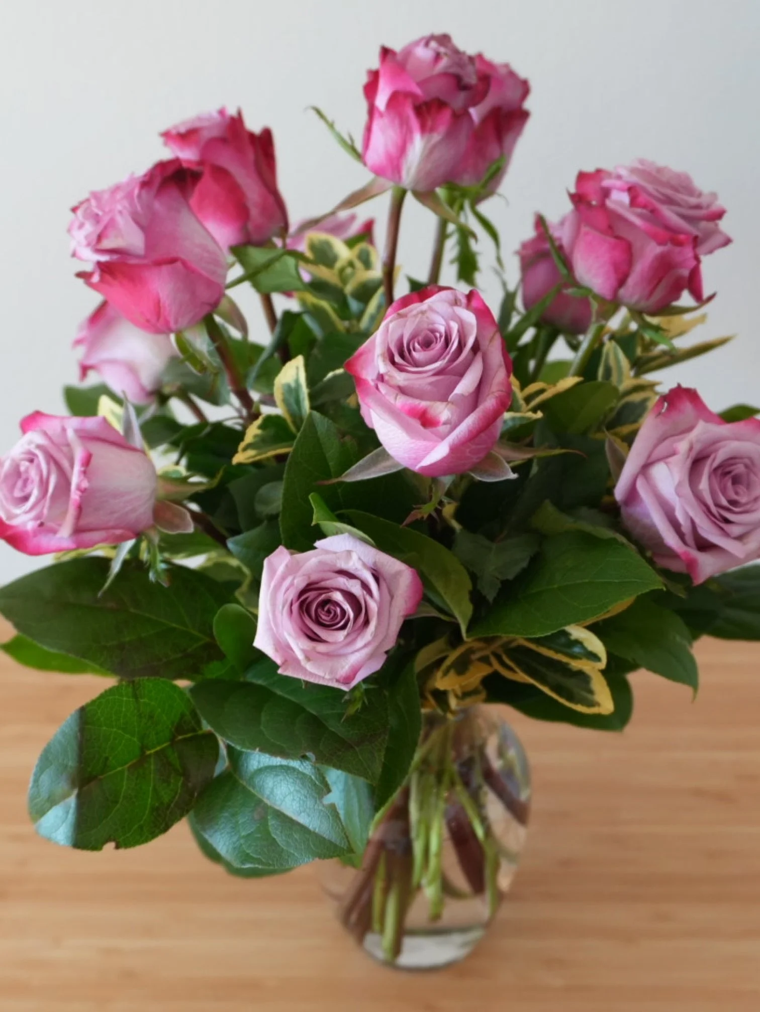 Lavender and purple roses with fresh greenery in a glass vase, arranged for gifting and home décor — handcrafted in Los Angeles.jpeg