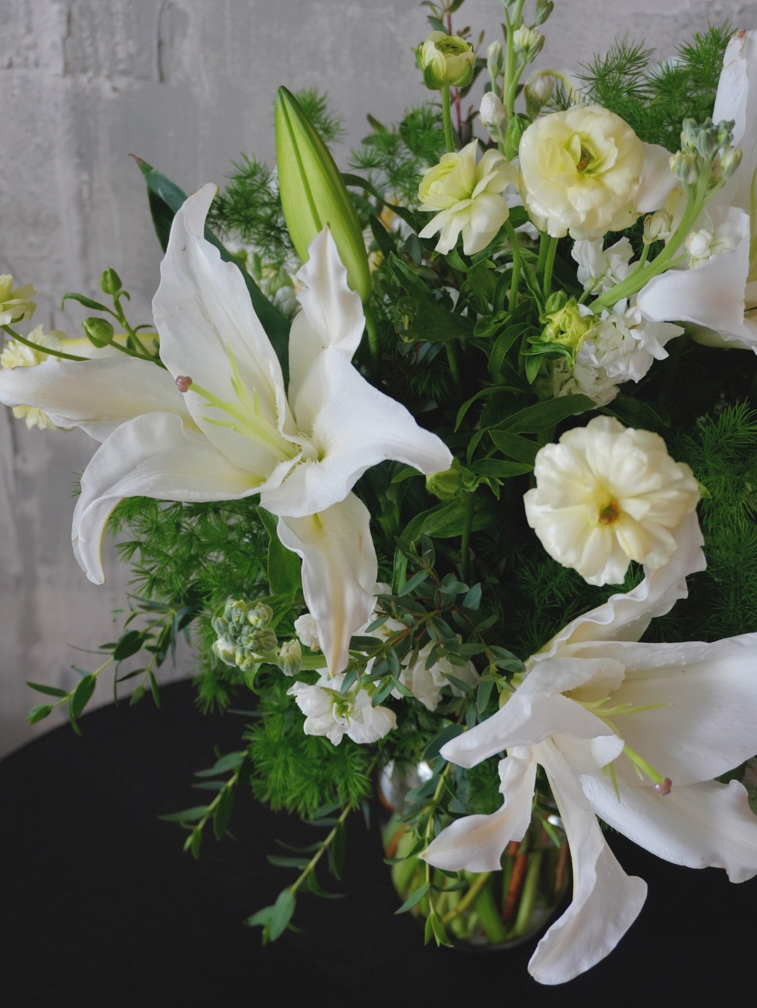 White lily floral arrangement close-up.jpeg
