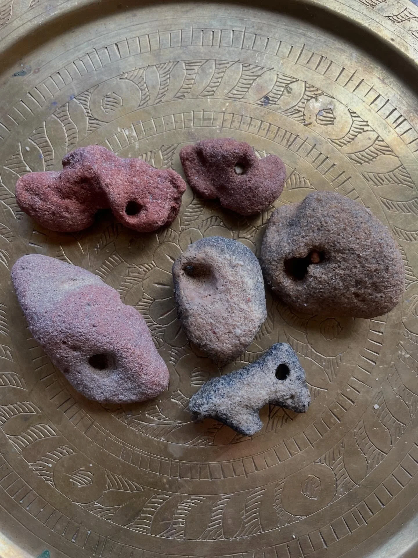 Always collecting hagstones. 
These look to be sandstone and one coral. Check the beautiful colours. 
Gifting these with the next 6 purchases ❤️

Hag stones are talismans, said to ward off evil, protect from nightmares and even see into the fae world