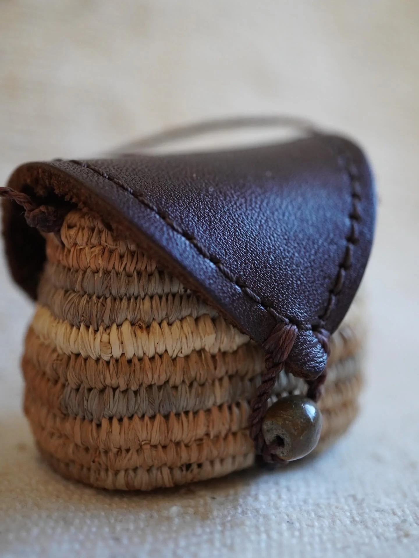 Such a sweet little necklace basket to collect and carry treasure. 
Dyed raffia with plants from Australia and woven while I was in France.