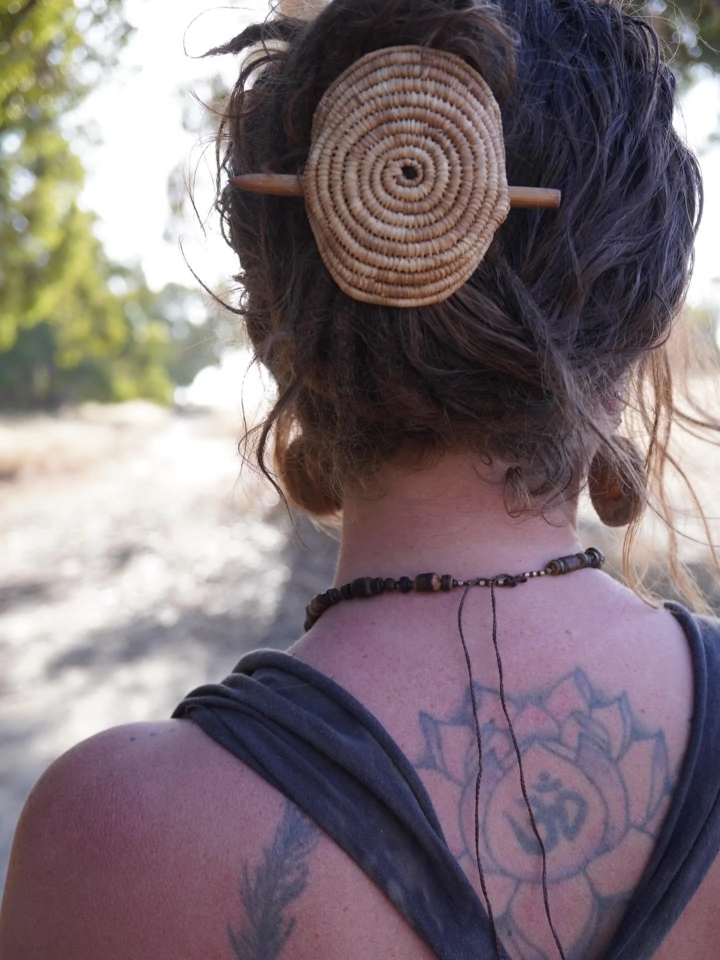 A simple hairpiece I made a few years ago while travelling in France, dyed with walnuts we found by a river in the mountains. 
I actually lost this one and only found it a few months ago when we went back to France. 
She will also be in my shop resto