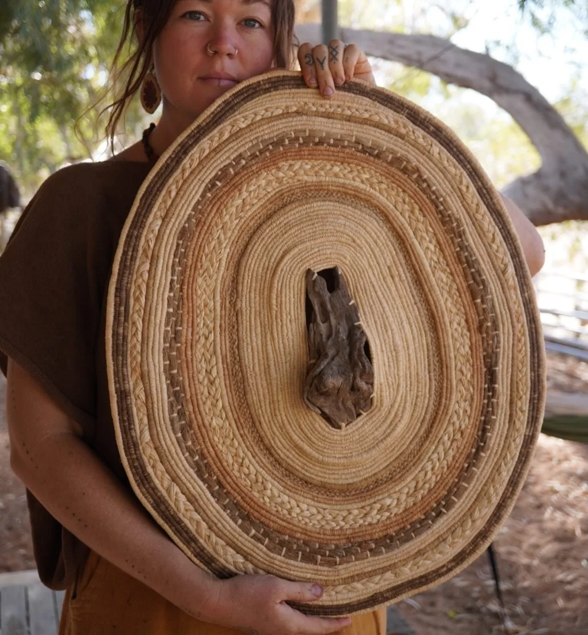 &ldquo;Earths pose&rdquo;
Centre collected while travelling near Kununurra WA, a favourite little town of mine with the loveliest people. 
Raffia dyed with onion skins and iron 
Palm sheath fibre collected in Carnarvon WA. 
This piece and colours are