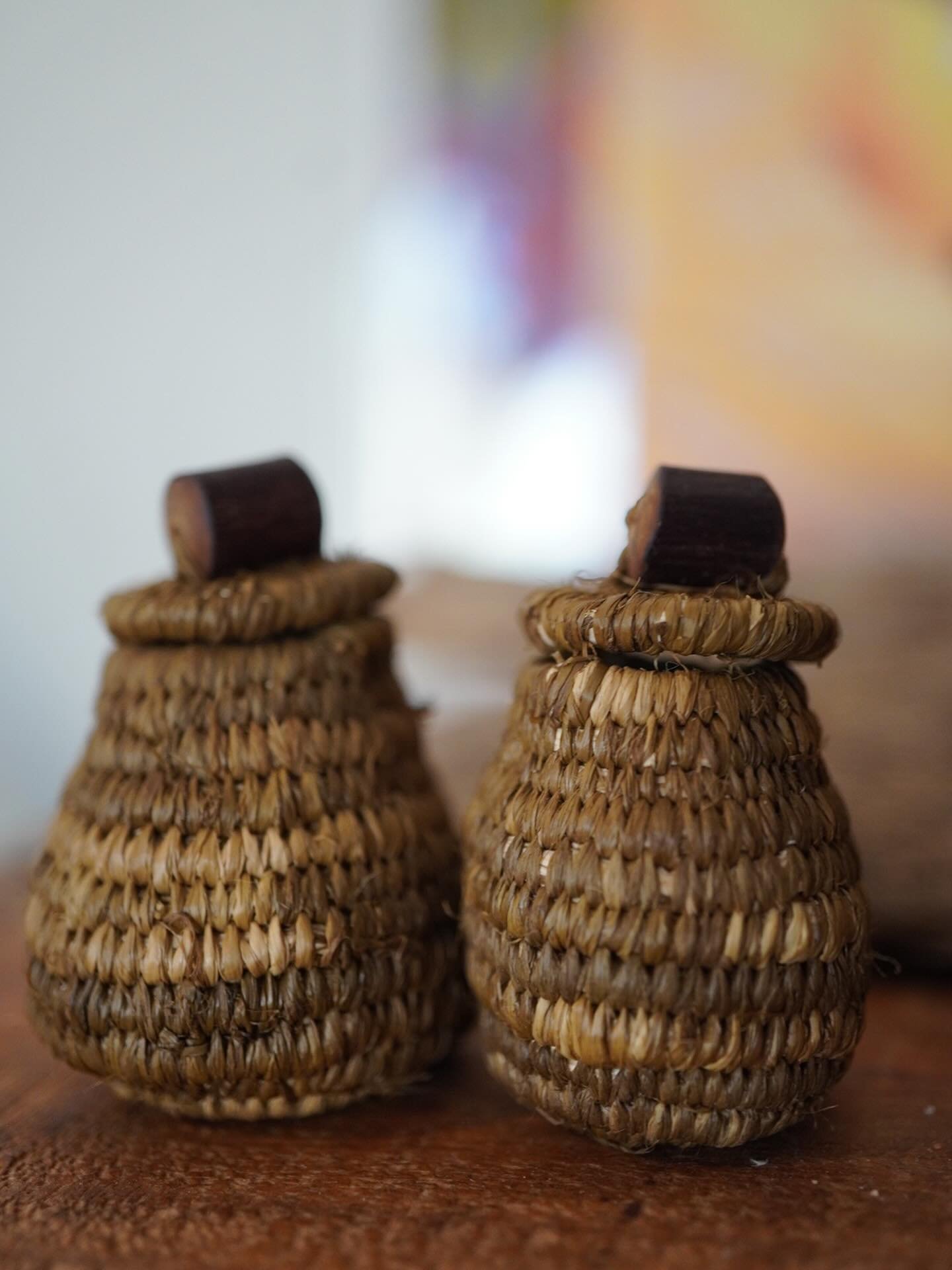 Two little baskets waiting to become necklaces to hold tiny treasures. 

Raffia dyed with onion skins and iron
