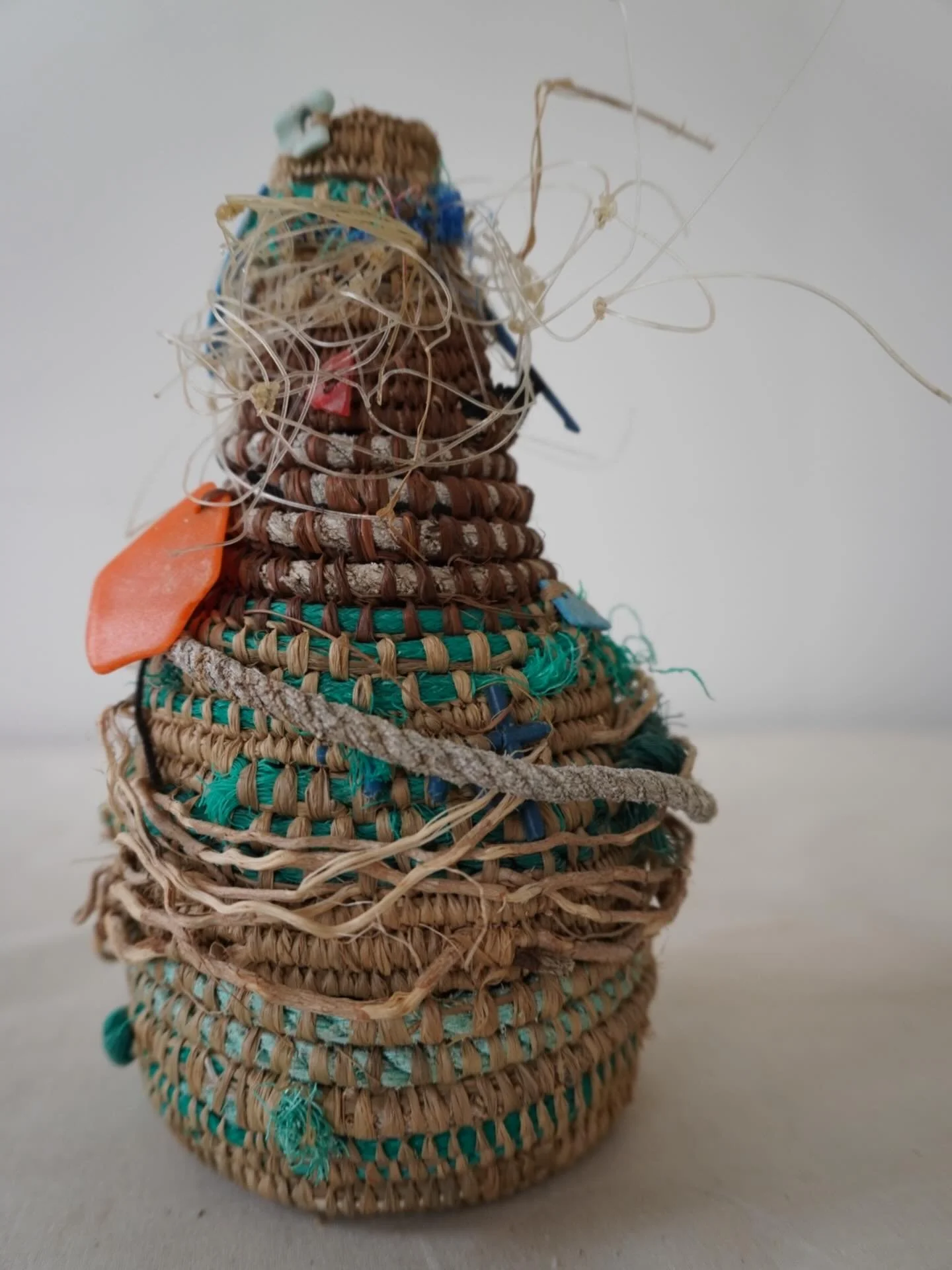 Many years ago I  lived in Tassie, on one trip to the west coast I would walk the beaches for plastic. 
I made 3 pieces with the plastic I found. 
A large wall hanging which now lives with an incredible artist, a vase which sold in a gallery and this