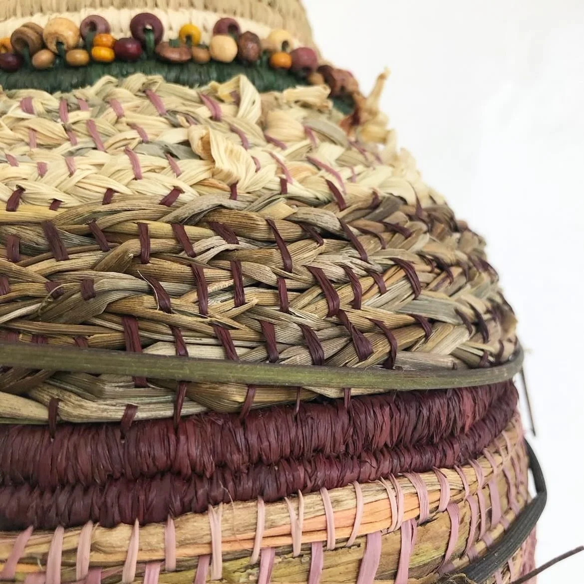 Another mixed medium piece from 2022 
This was a fun piece using a old base then a mix of raffia, corn husk, different grasses, beads and vine. Some where platted some were woven as it. I didn&rsquo;t make many like this basket but she was quiet a fu