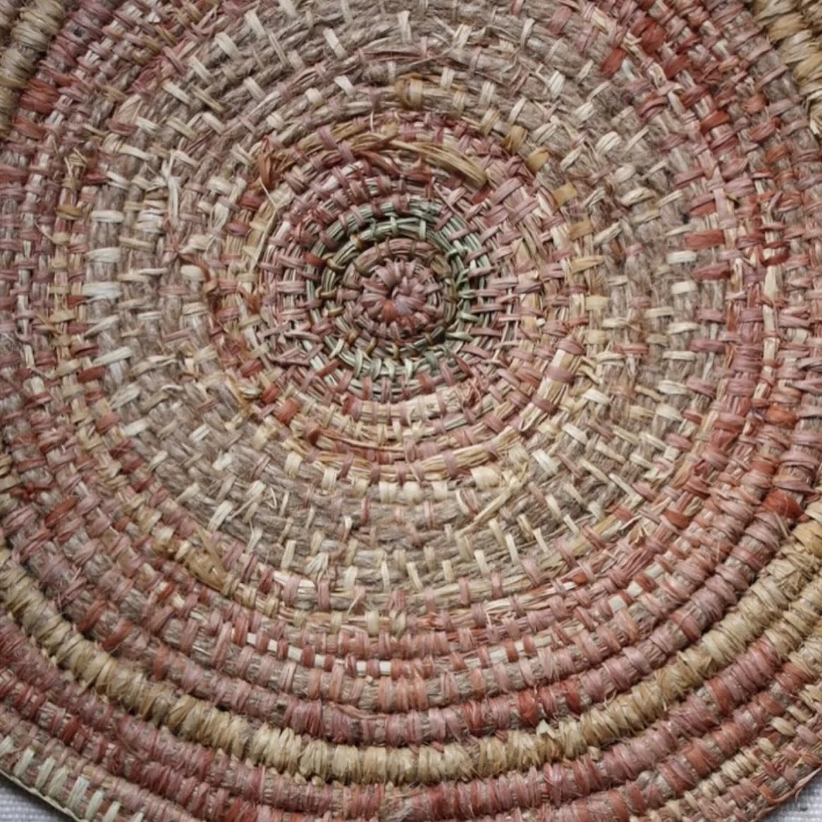 This is the centre of my wall piece I posted a few days ago. Originally it was going to be a hot mat, made with left over pieces of raffia, some lomandra and jute. 
My hot mats get destroyed pretty quickly as we use gas and fire with our pots so this