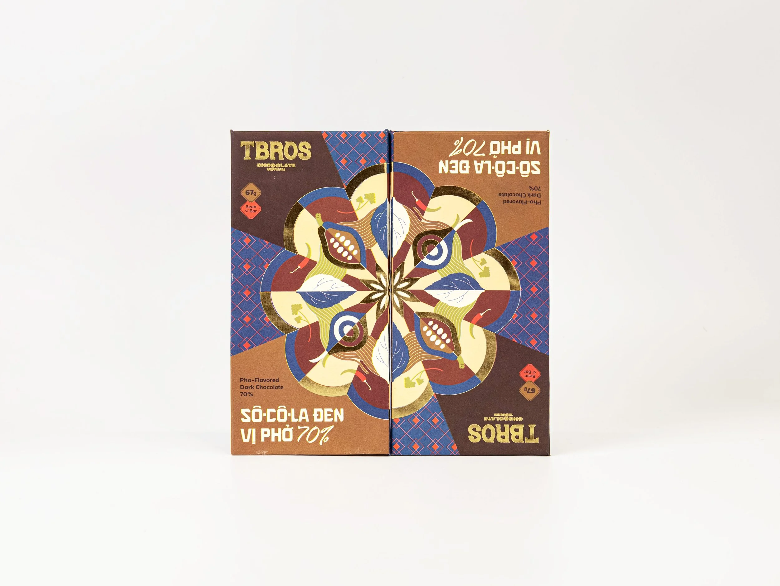 Two dark chocolate snack boxes with a symmetrical, colorful, floral design on the front, positioned against a white background.