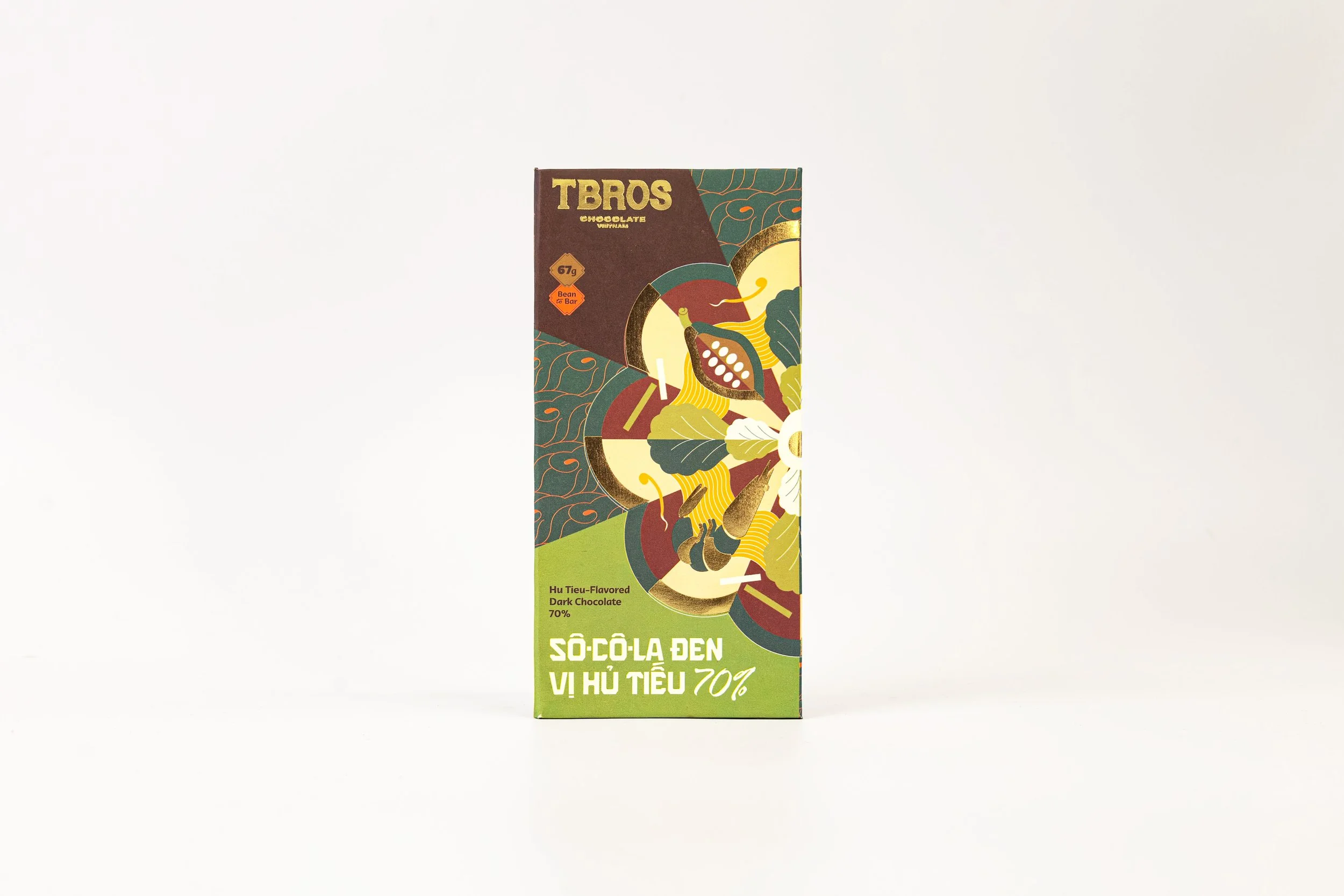 Colorful dark chocolate bar packaging with stylized abstract artwork and text in Vietnamese and English, indicating the flavor is Hu Tieu and 70% cocoa content.