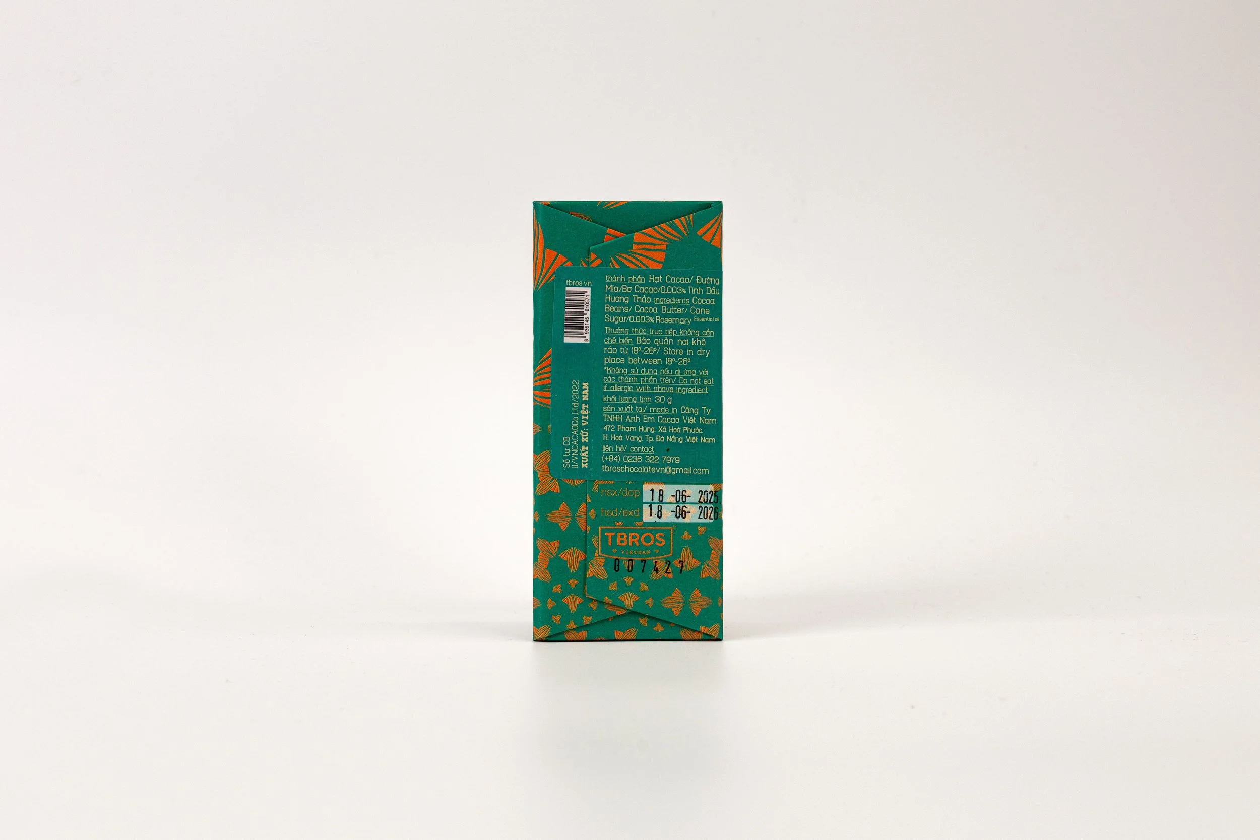 A teal and orange patterned box of TBROS Vietnamese sugar cubes standing upright on a white background.