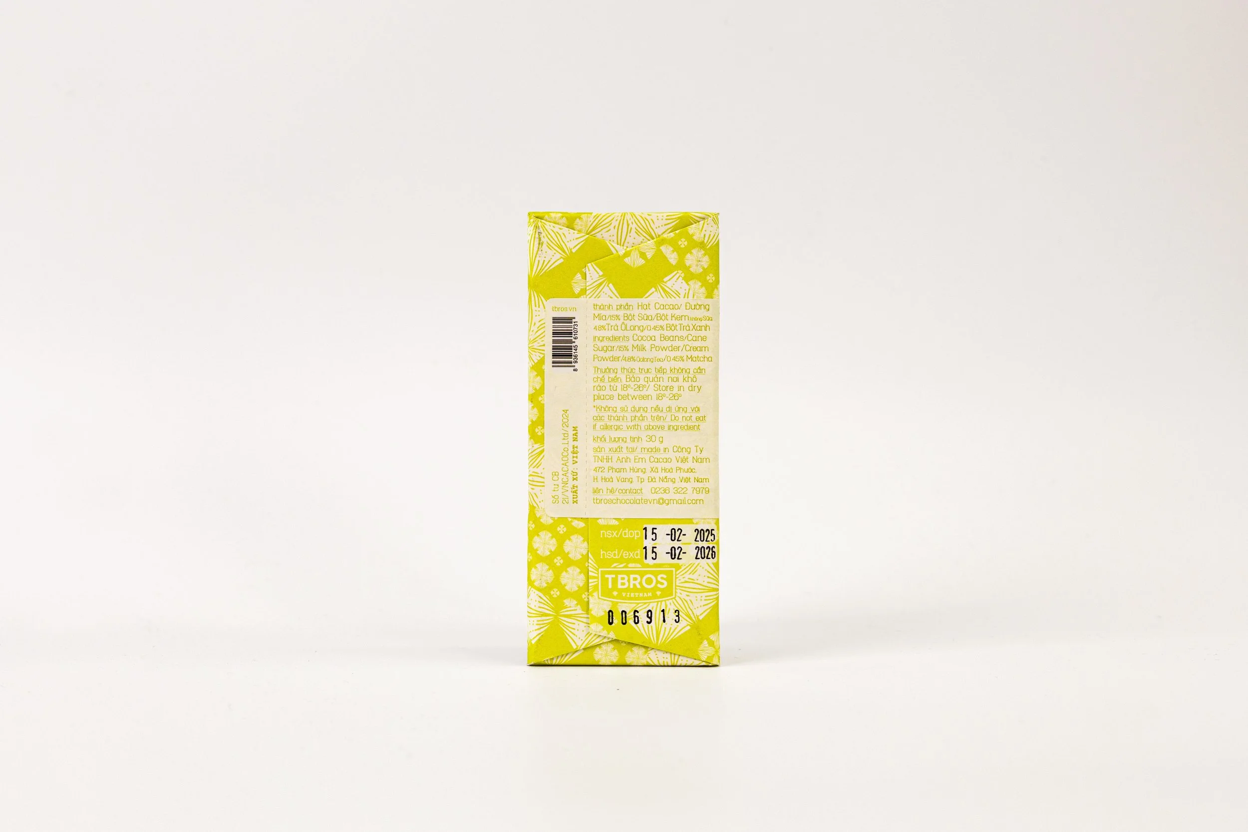Yellow packaged product with detailed text on the back, standing upright on a plain white surface.