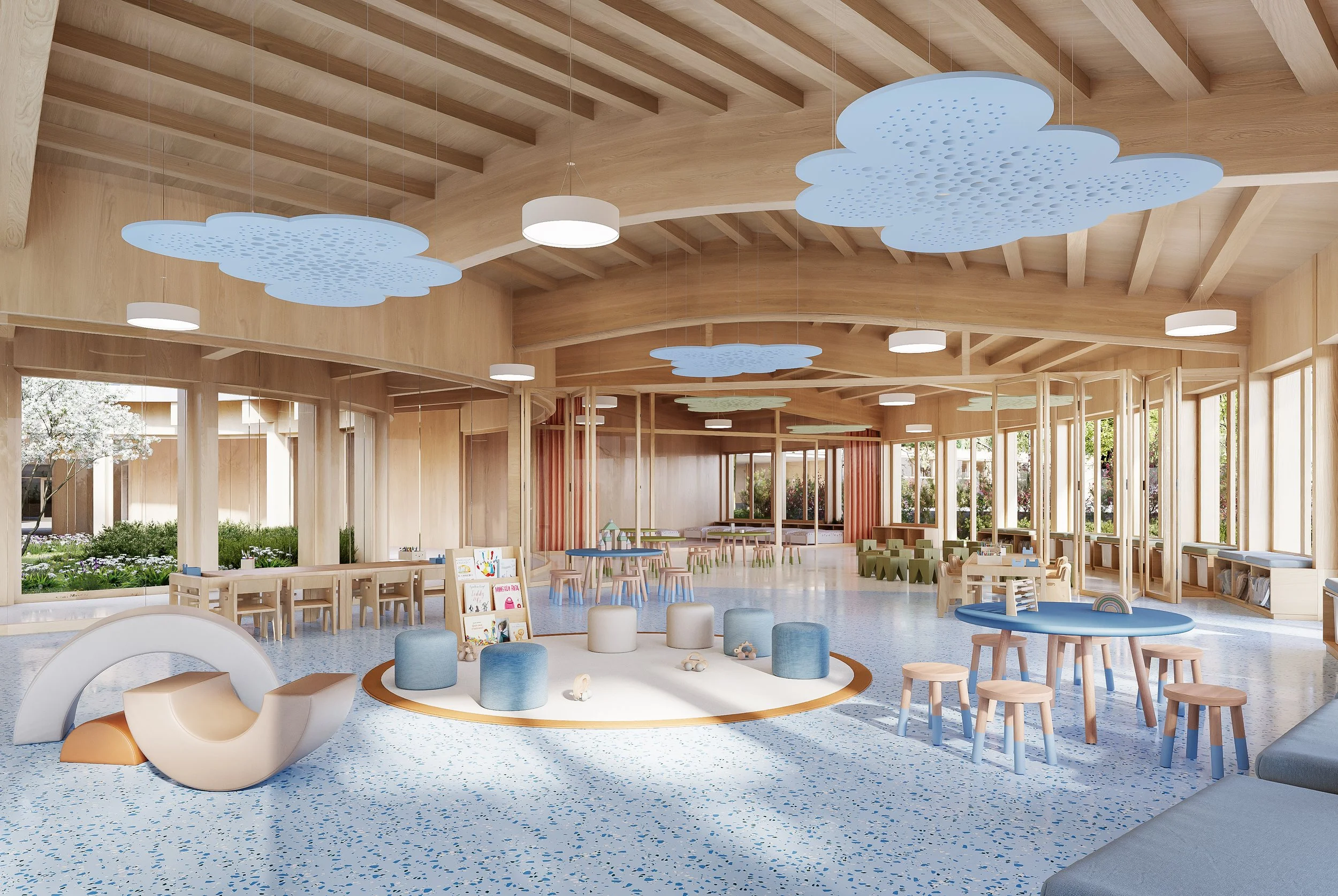 A spacious, modern children's indoor playroom with wooden beams, cloud-shaped ceiling lights, large windows, and various colorful furniture and play areas.