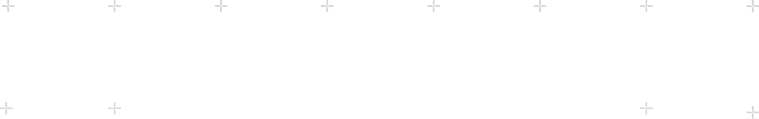 Close-up of a butterfly perched on a human finger, with a blurred natural outdoor background.