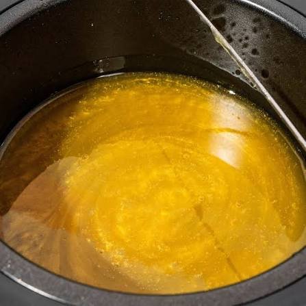 A close-up of a wax pot.