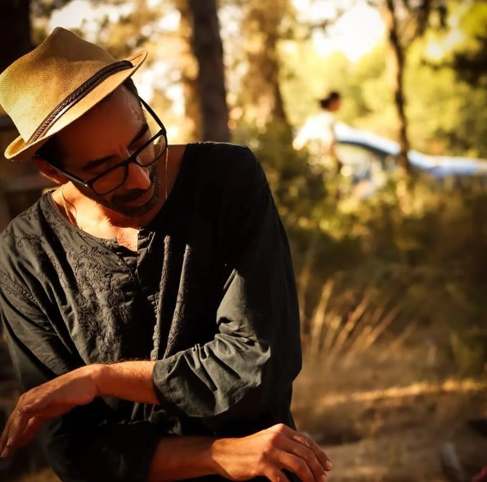 woman on white dress, dancing, smiling, in a natural environment