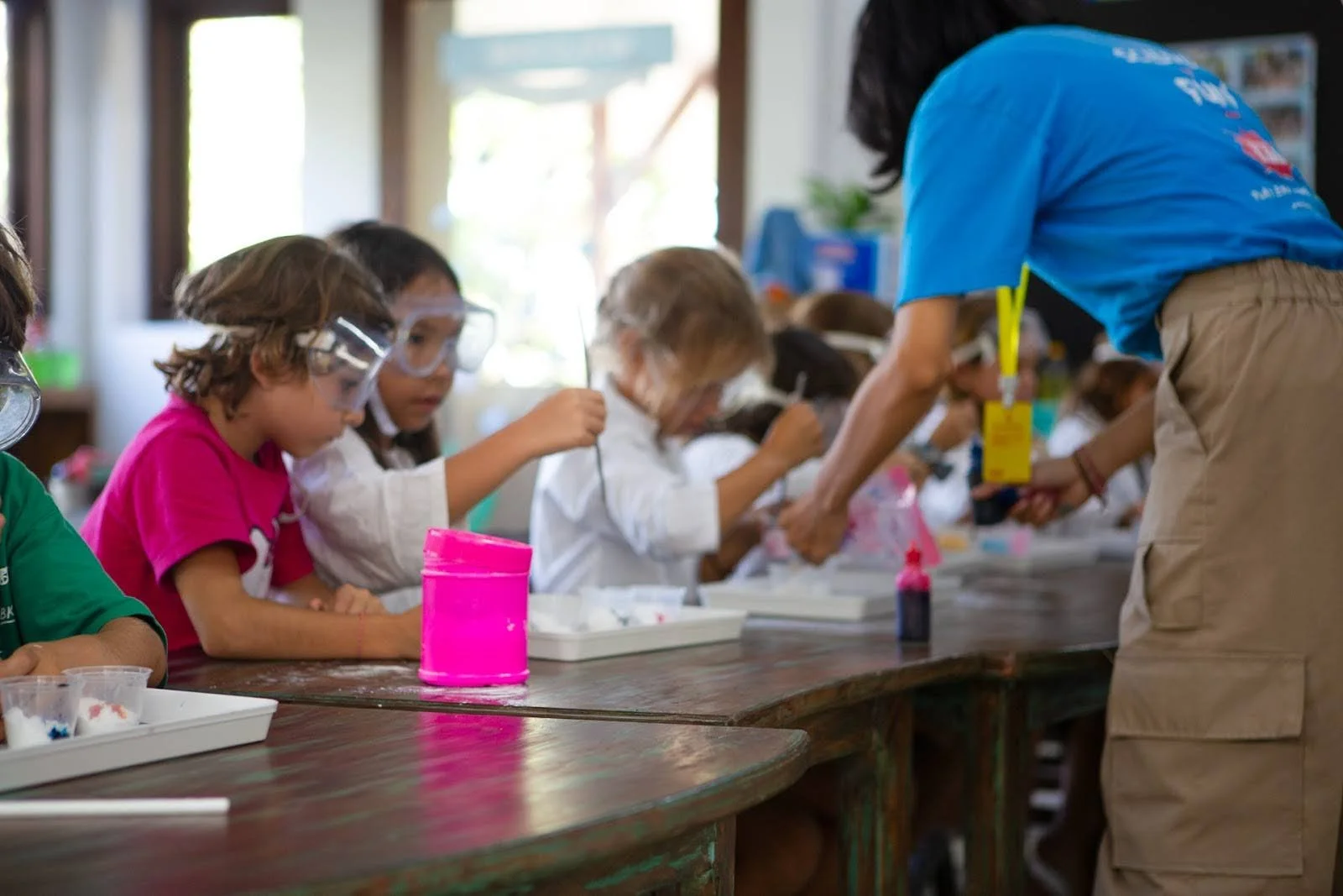Young students conducting a science experiment in a classroom at Uluwatu School in Bali