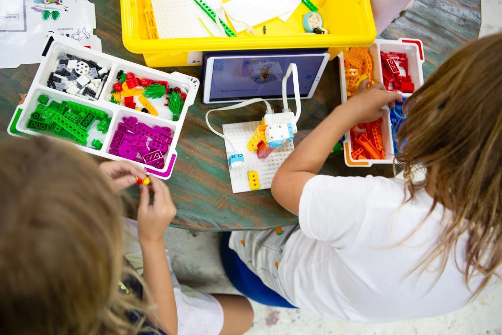 Students working on a robotics and LEGO building activity at Uluwatu School in Bali