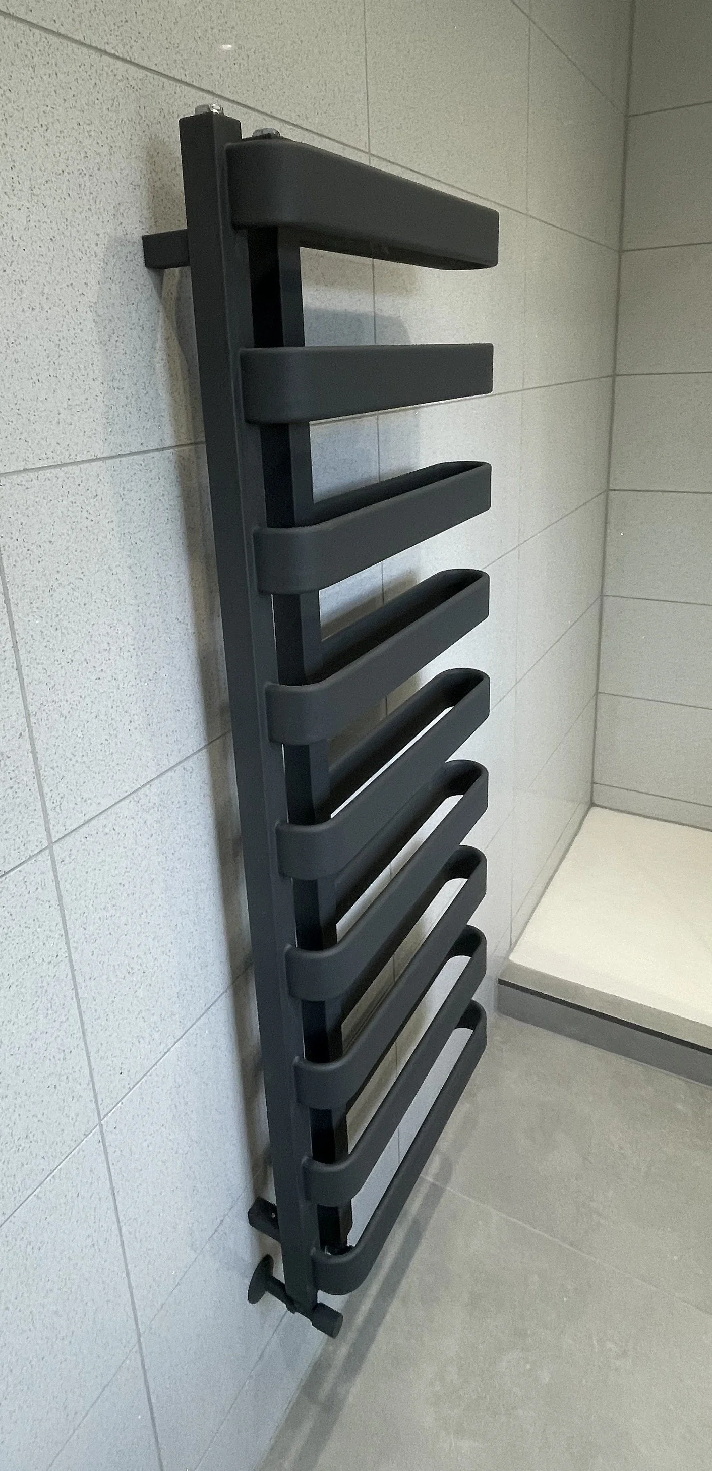 Contemporary anthracite designer radiator installed as part of a luxury bathroom renovation.