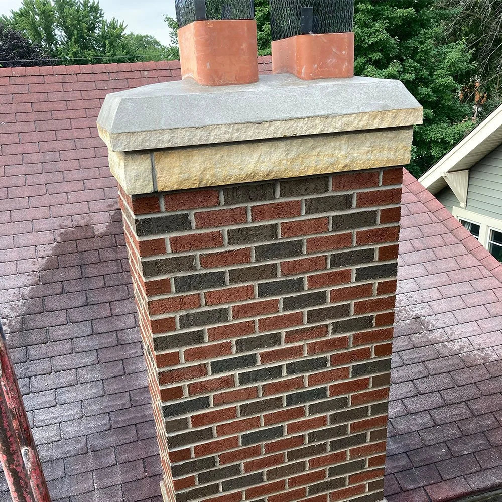 a dark red brick chimney