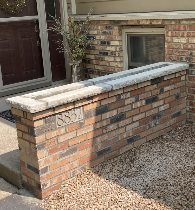 brick planter with home address on it