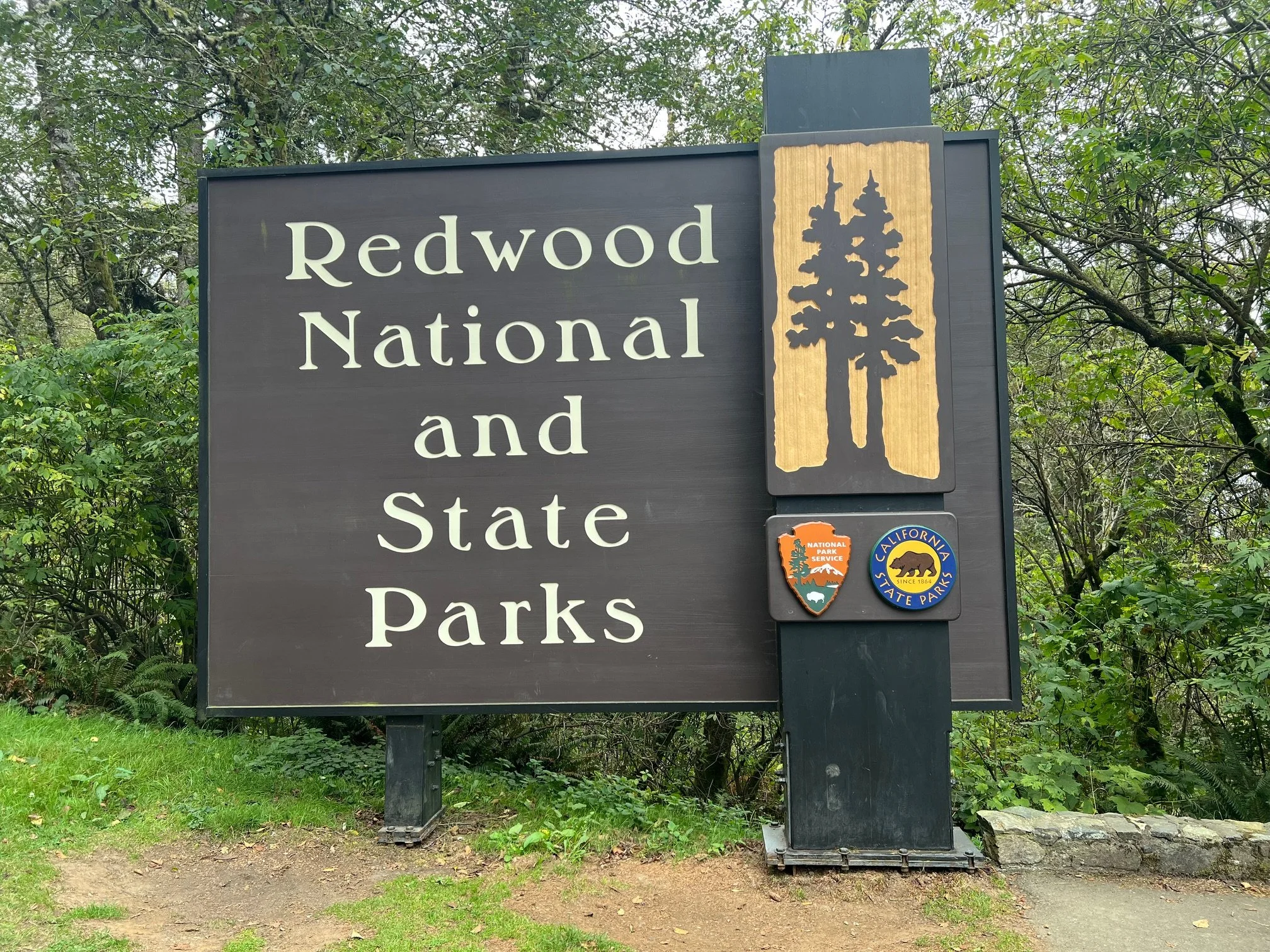 Welcome sign at Redwoods National and State Parks along scenic Northern California route