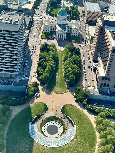 View of the historic Old Courthouse in St. Louis as seen from the top of the Gateway Arch, showcasing iconic architecture and city landmarks
