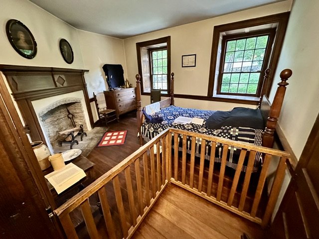 Bedroom where Daniel Boone died, with a period bed and historic furnishings.