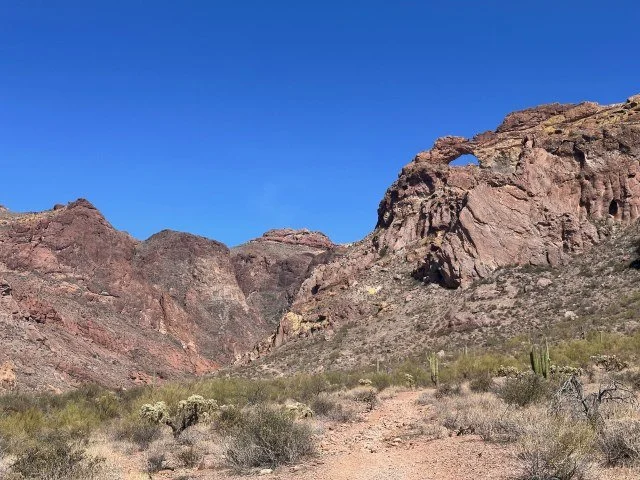 Natural double arch in Arch Canyon at Organ Pipe Cactus National Monument, showcasing the dramatic desert landscape of southern Arizona.