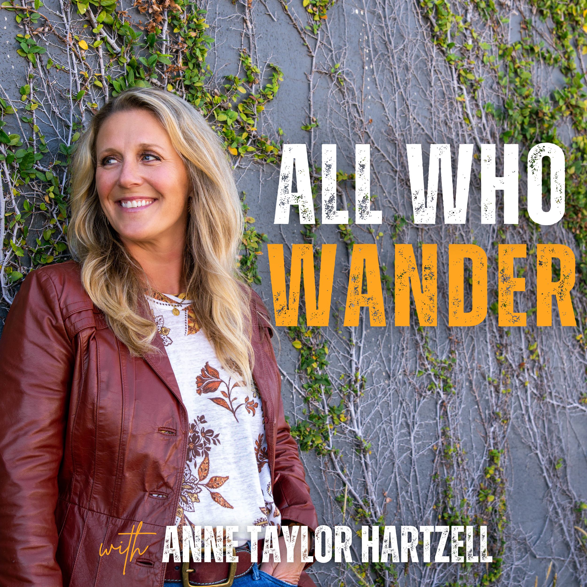 A smiling woman with blonde hair wearing a maroon leather jacket over a white shirt with floral patterns, standing in front of a wall with green vine plants, with overlay text reading 'All New' and 'with Anne Taylor Harzell'.