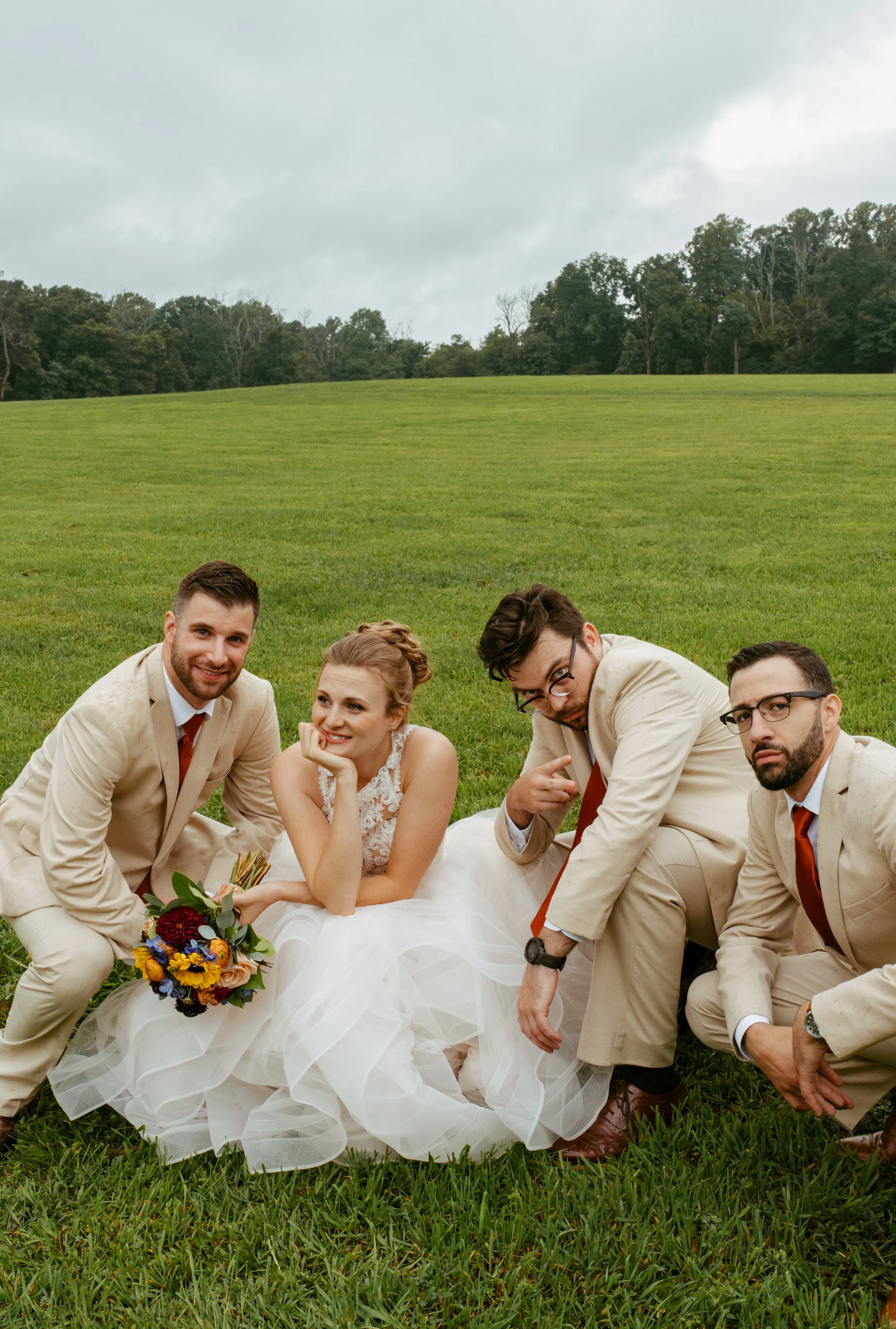 bride and groomsmen being goofy and happy