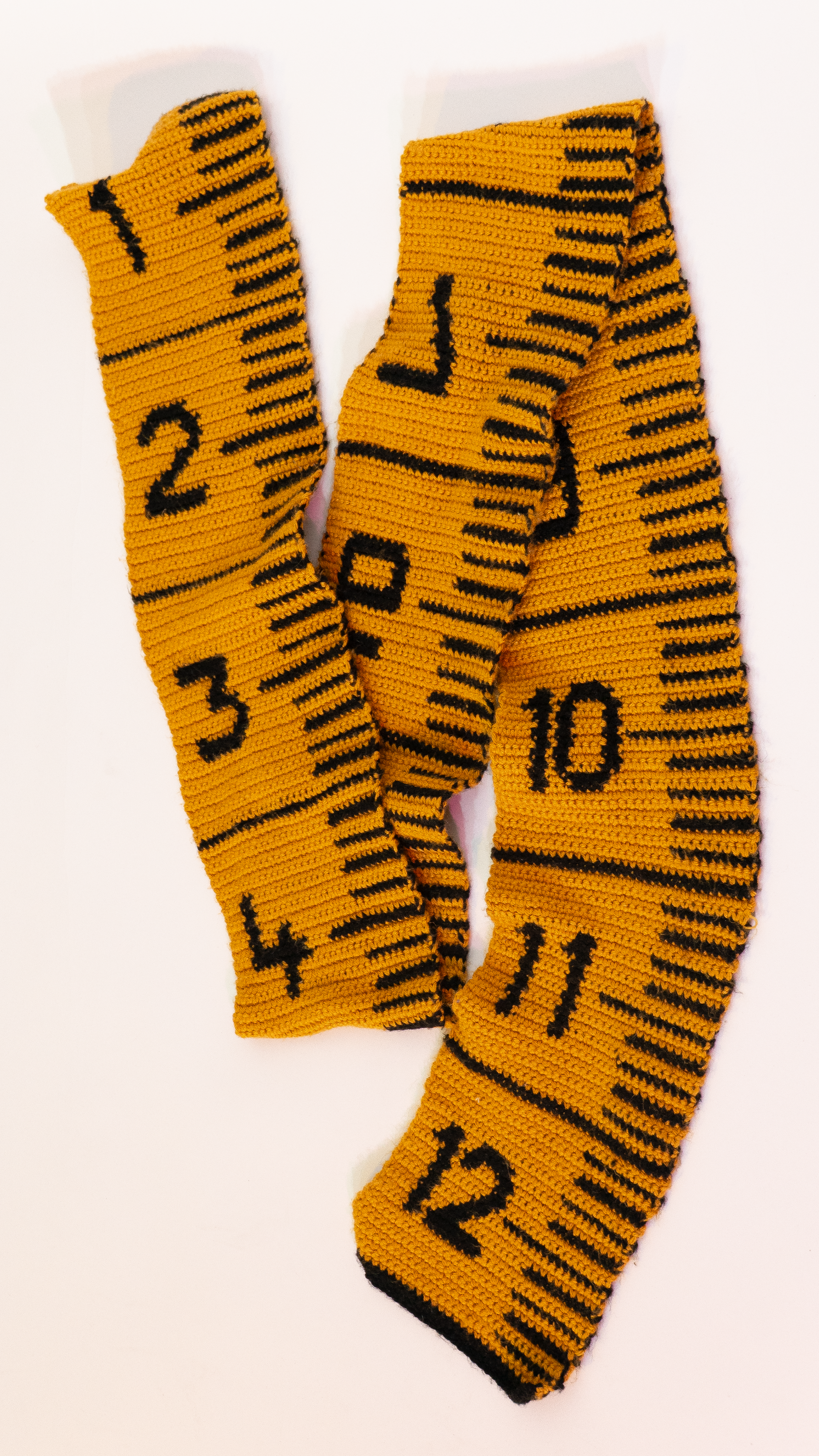 Crocheted tape measure scarf.