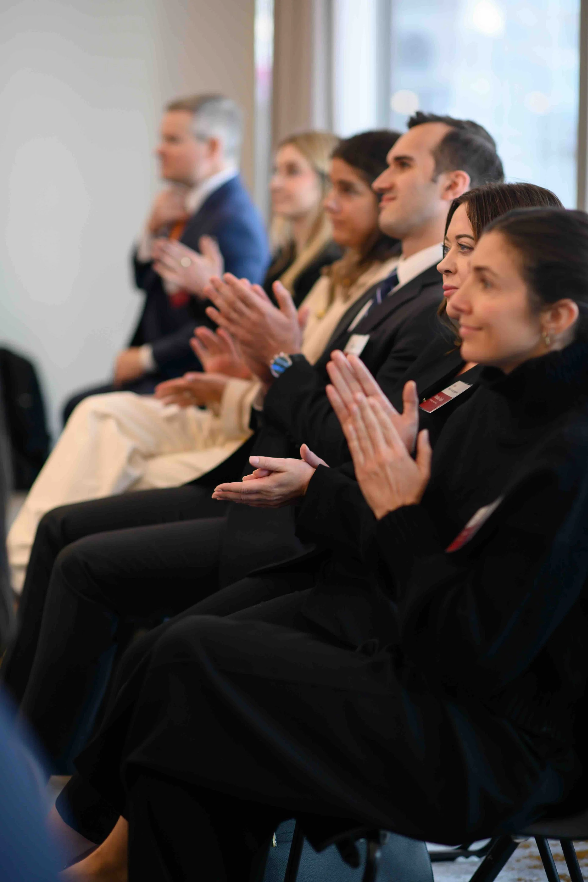 Attendees applauding during a session at the Hines symposium
