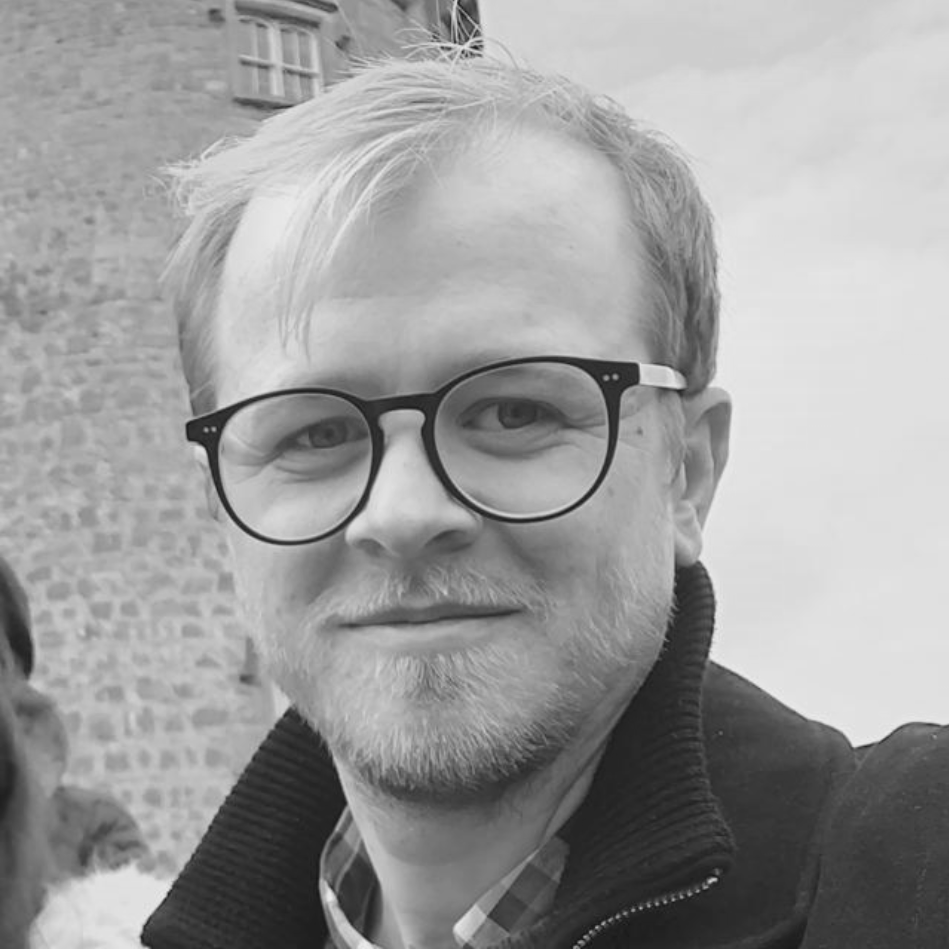 Black and white headshot of Ashley Grealish, the co-founder and CEO of Windfall Energy
