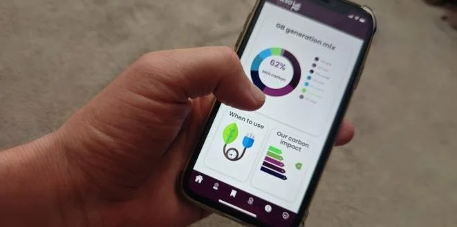 NESO app interface on a smartphone screen showing live UK grid energy mix and optimal times to charge home devices.