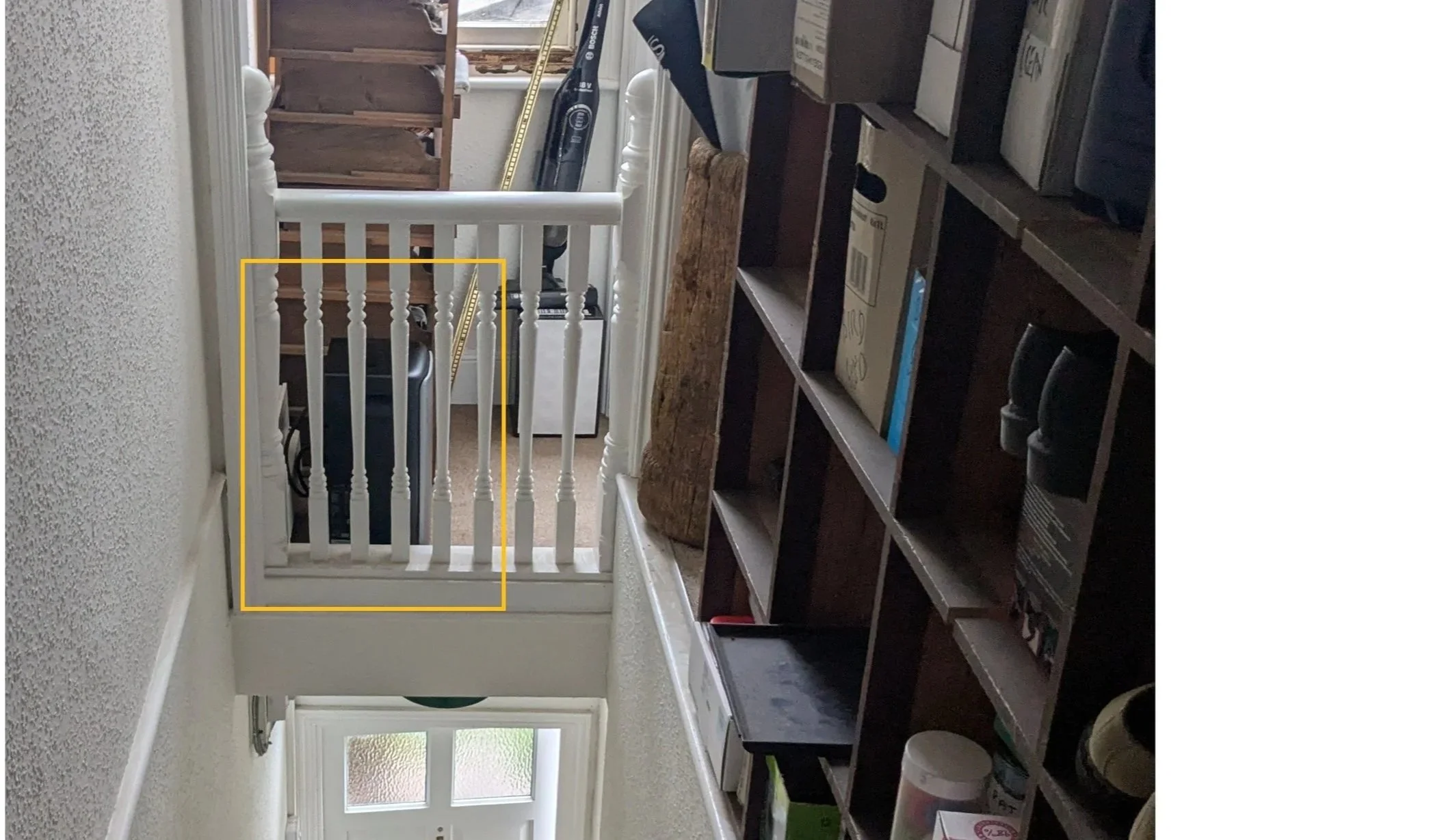 Compact plug-in battery installed neatly on a top-floor UK flat cul-de-sac landing.