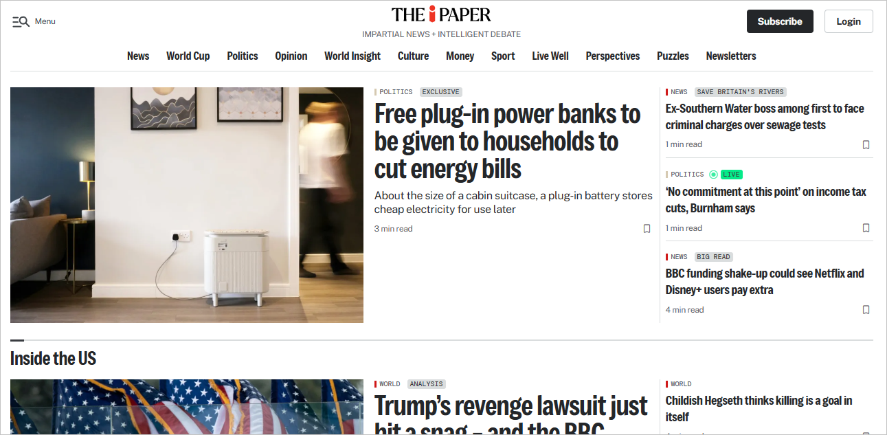 The i Paper article featuring a cabin suitcase-sized Windfall plug-in battery plugged into a UK wall socket.