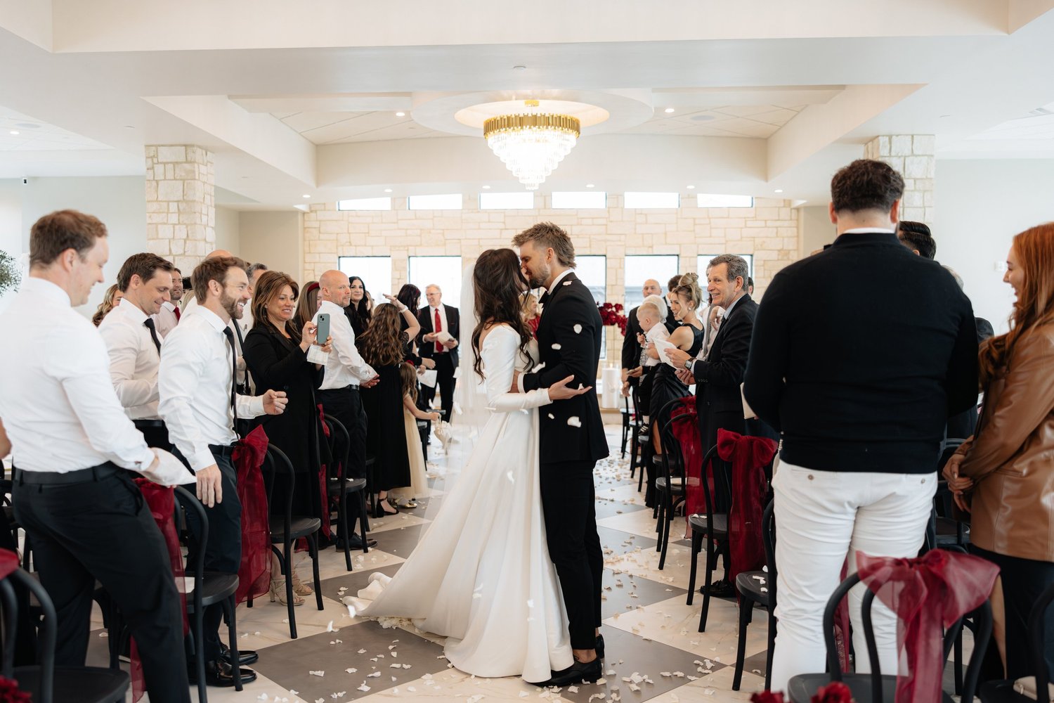 Bryce and Alexis sharing a kiss during their wedding celebration