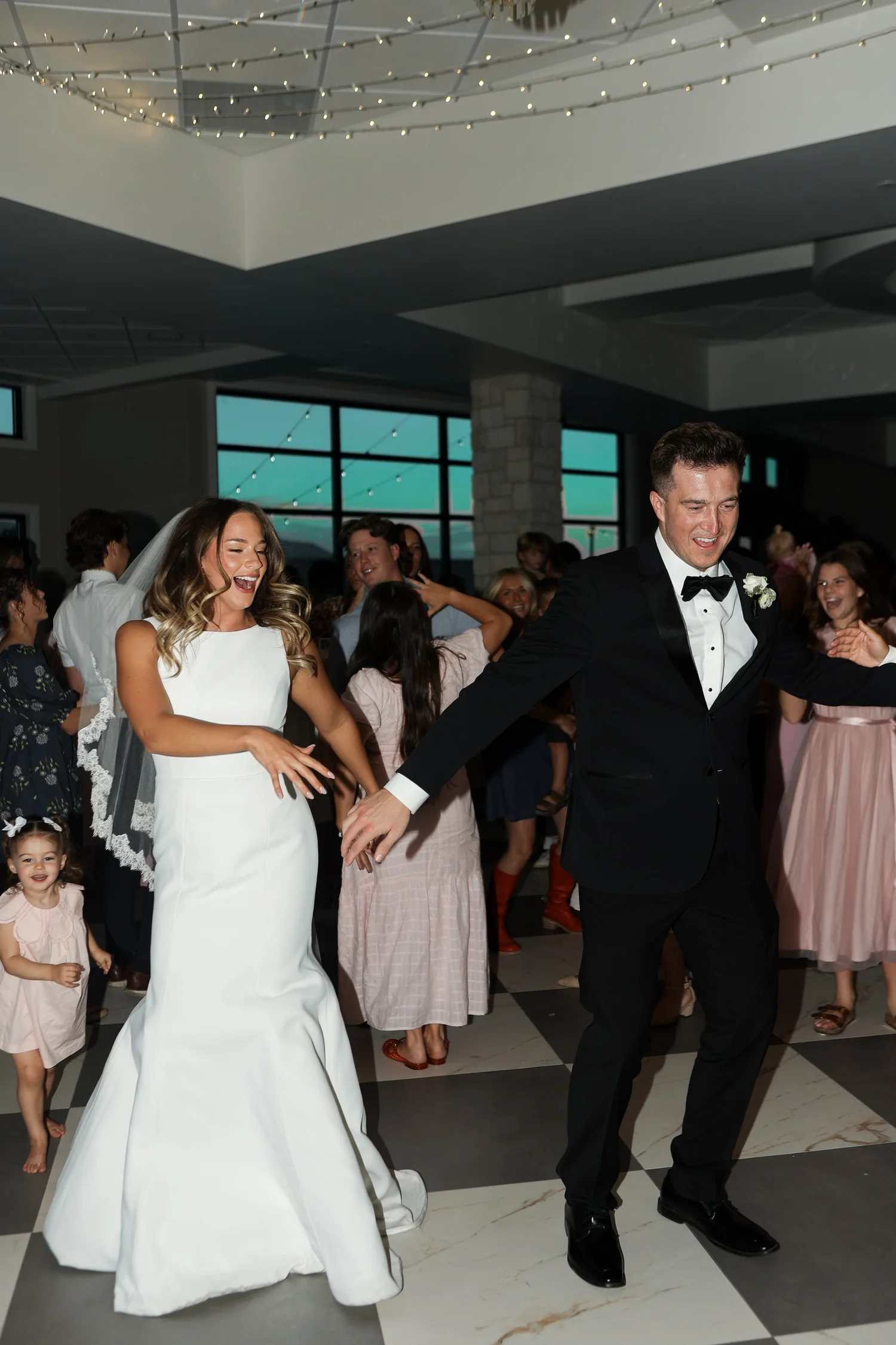 Cameron and Tara celebrating with their wedding guests