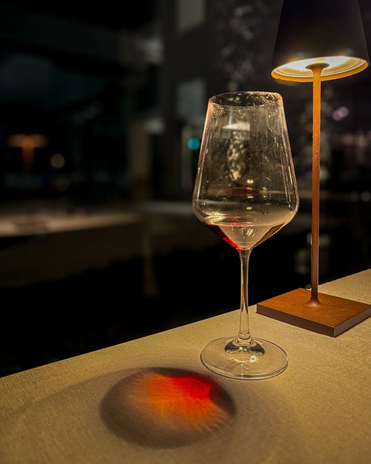 A glass that once held a conversation.

#CinematicStill #VisualPoetry #TableForOne #WineMood #MoodyVibes #LowLightMagic #QuietMoments #ShadowAndLight #StoryInAFrame #MinimalMood #EveningElegance #GlassOfTime #FineArtPhotography #VisualStorytelling #W