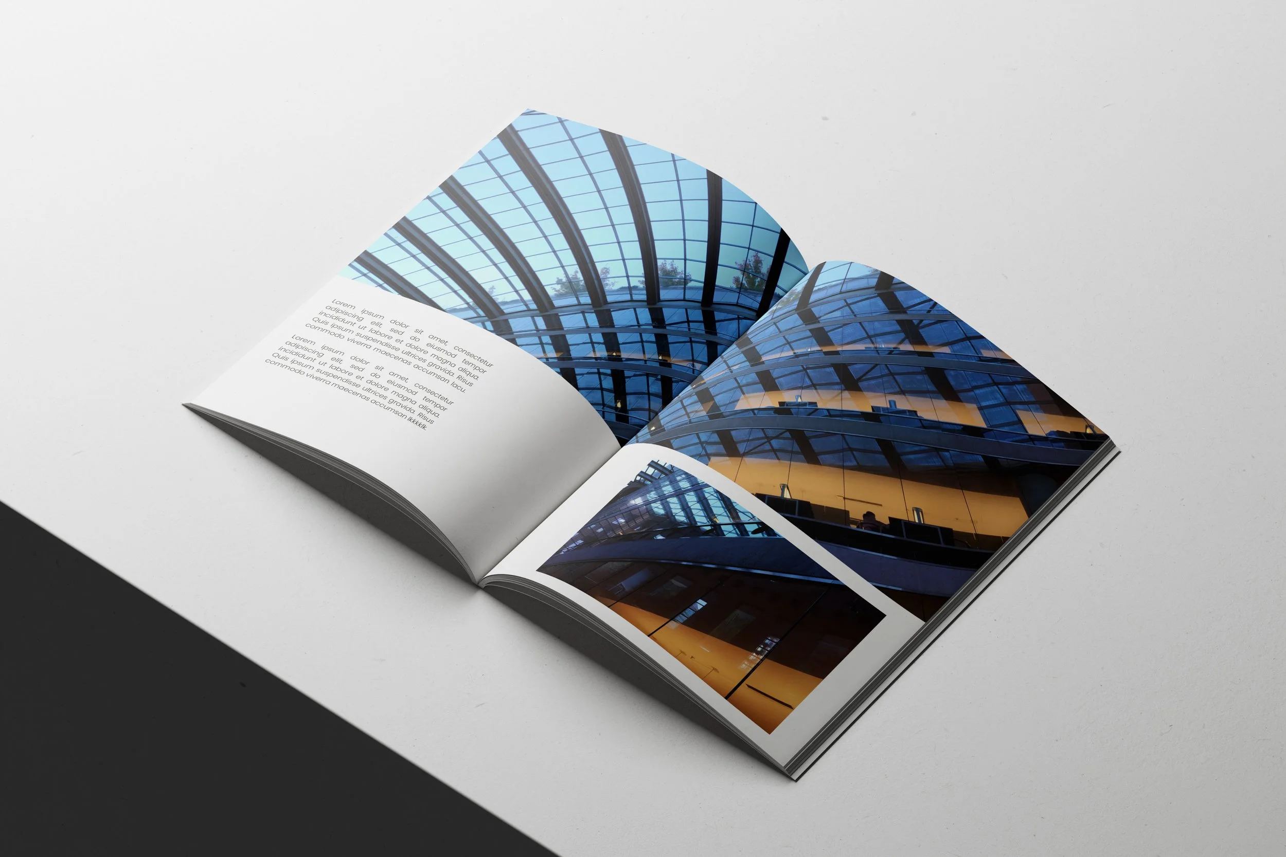 01 Free A4 Magazine Mockup Open on Minimal White Surface.jpg