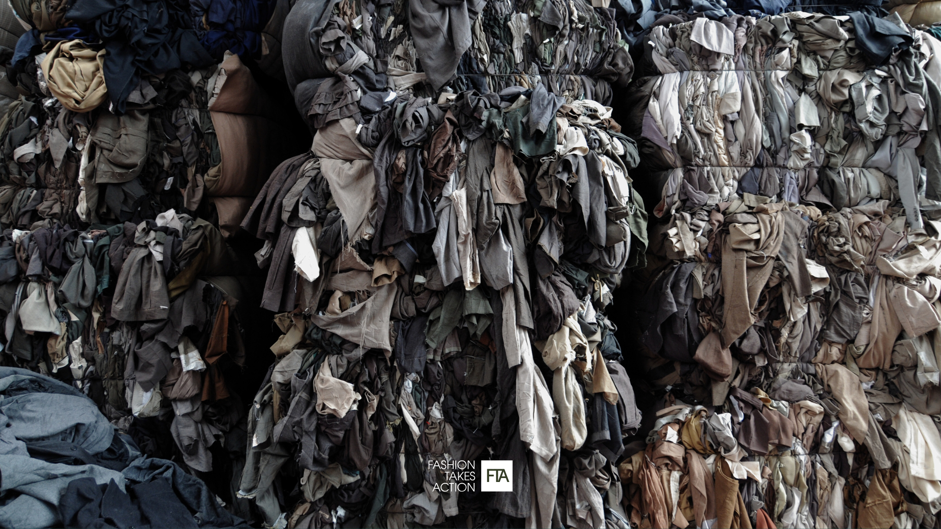 Image of textile waste piled in landfill