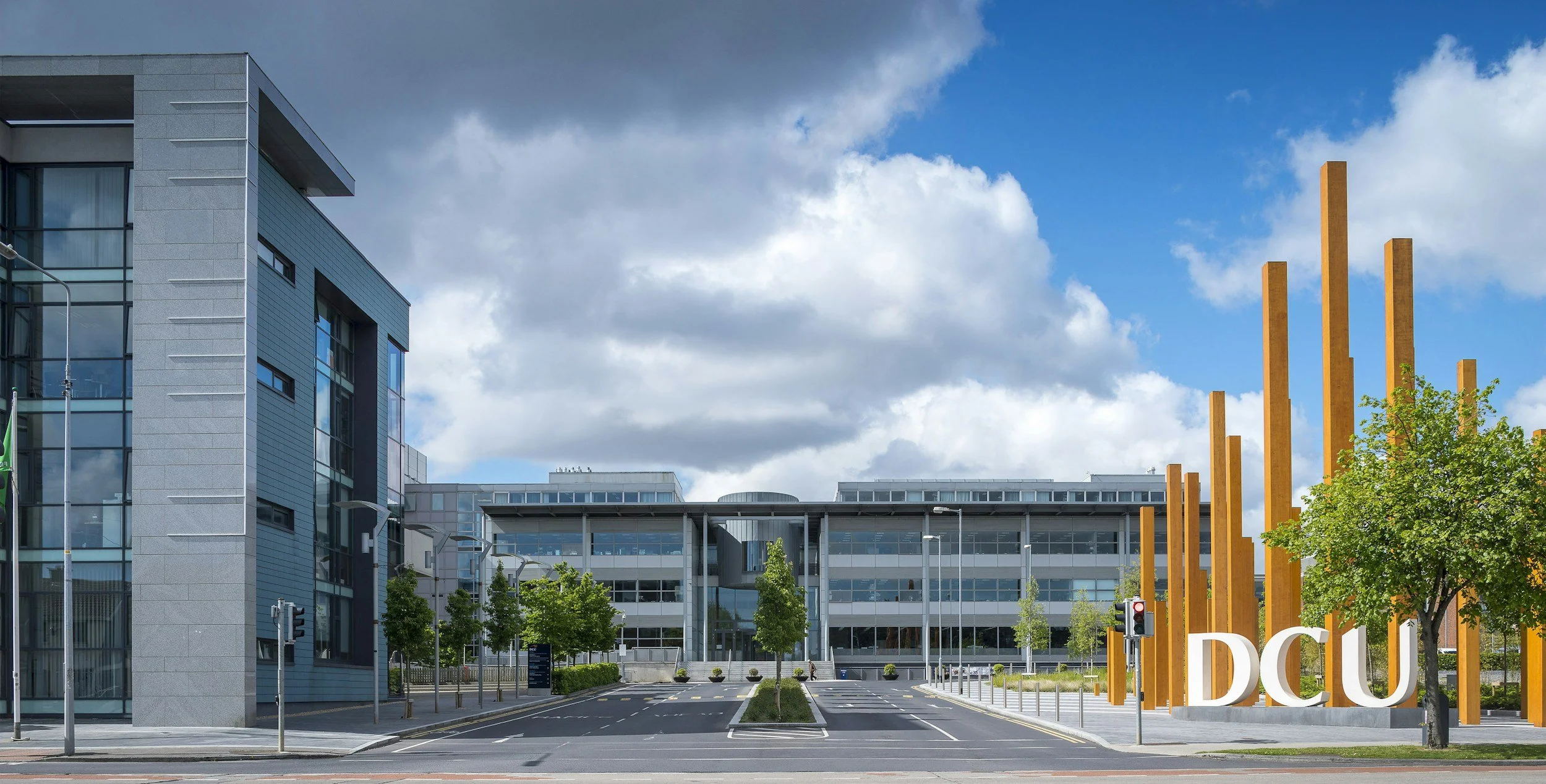 Modern building with glass windows and a sign reading