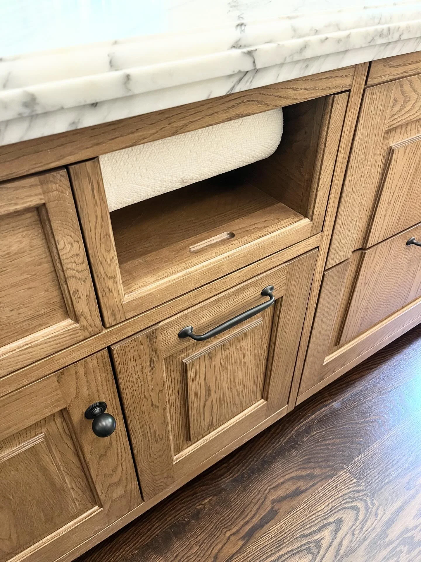 Clever integrated PS White Oak paper towel roll &amp; storage pull-out in the Kitchen Island designed by @leascheinstudio ✨