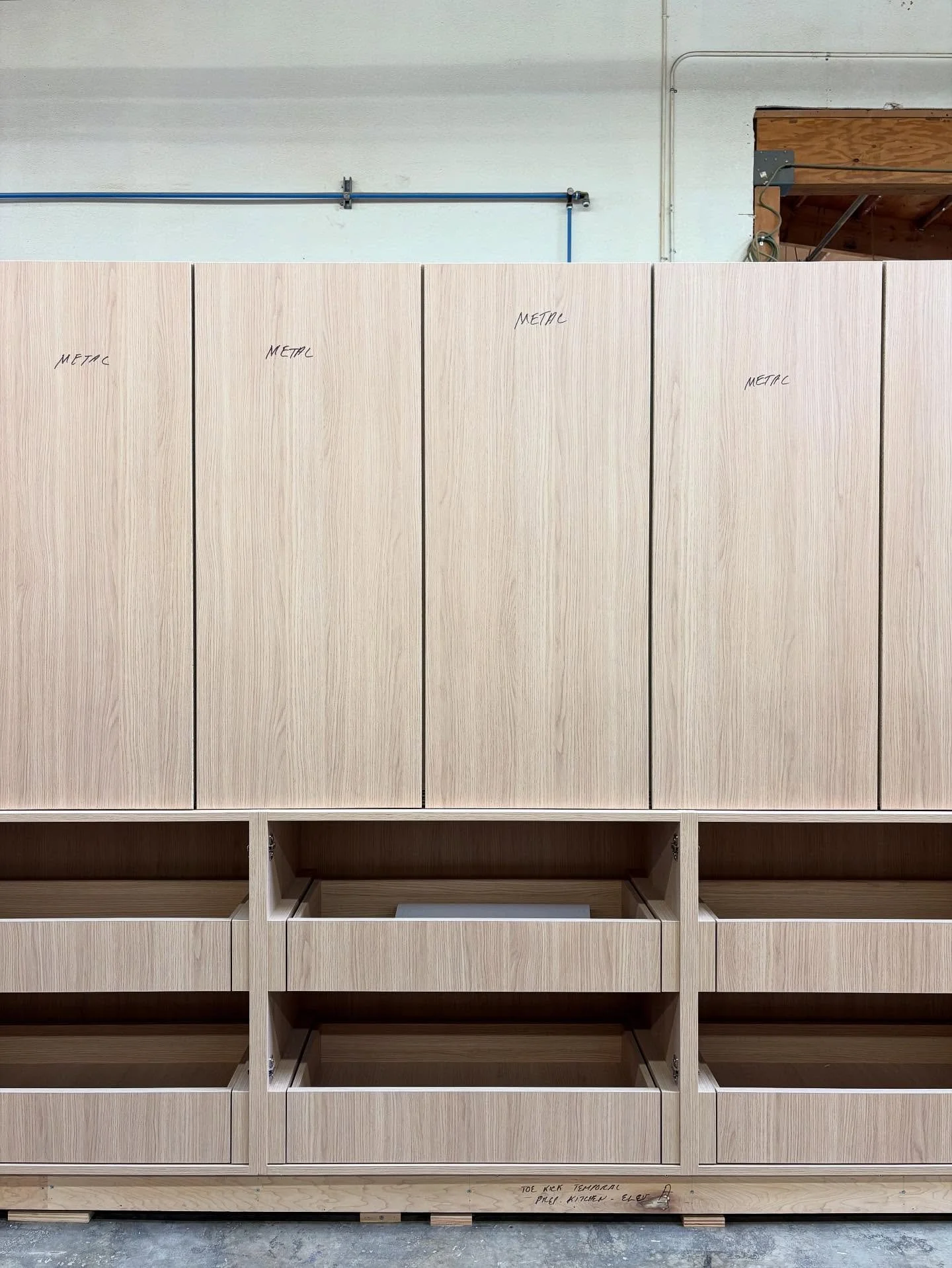 Vicenza Oak Working Pantry uppers &amp; lowers with pull-outs is almost fully staged and ready for exterior doors to be clad in stainless steel! ✨ 

Swipe to see the routing done at the bottom edge of the upper cabinet doors in preparation for integr
