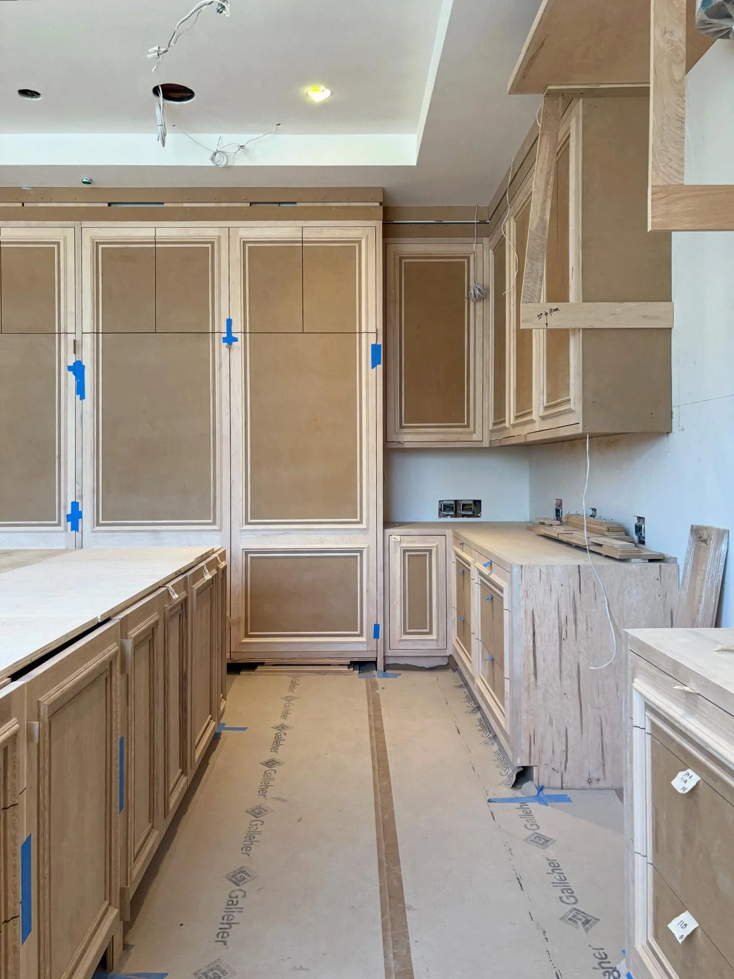 Paint Grade Kitchen perimeter with split-doors and applied moldings complimented by our 1 of 2 Rift Oak Islands! 🏝️ 

This Kitchen makes for the ultimate cooking experience! 🧑&zwj;🍳 🍳 🥦 🥩 

Ready for Kitchen hood and stone tops⛰️✨