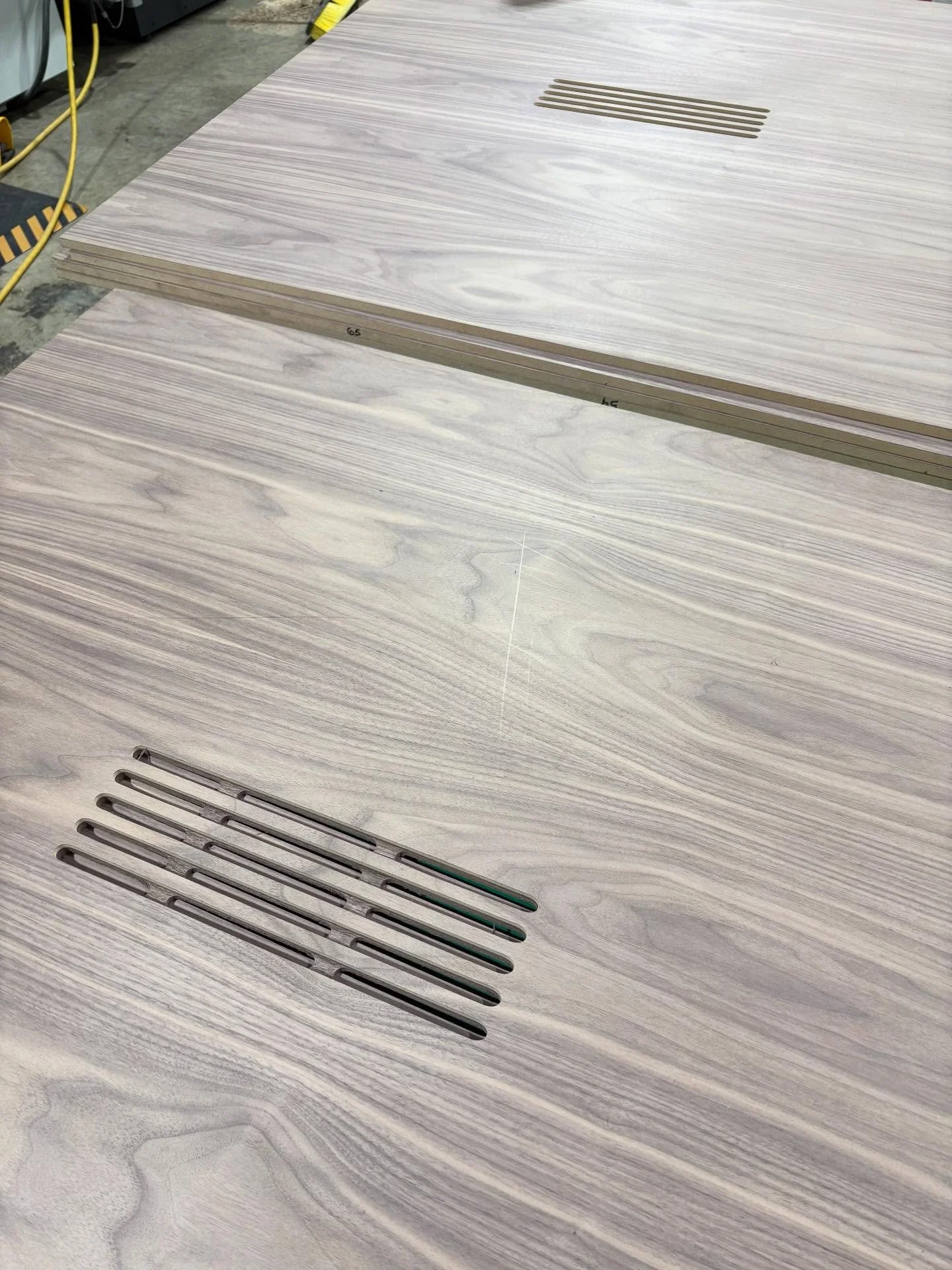 Plain Sawn Walnut panels with 1/2&rdquo; routed slots for speakers 🔊 🎶 and to mitigate the exposed core of the support bridges, we inlaid a solid Walnut piece 💫