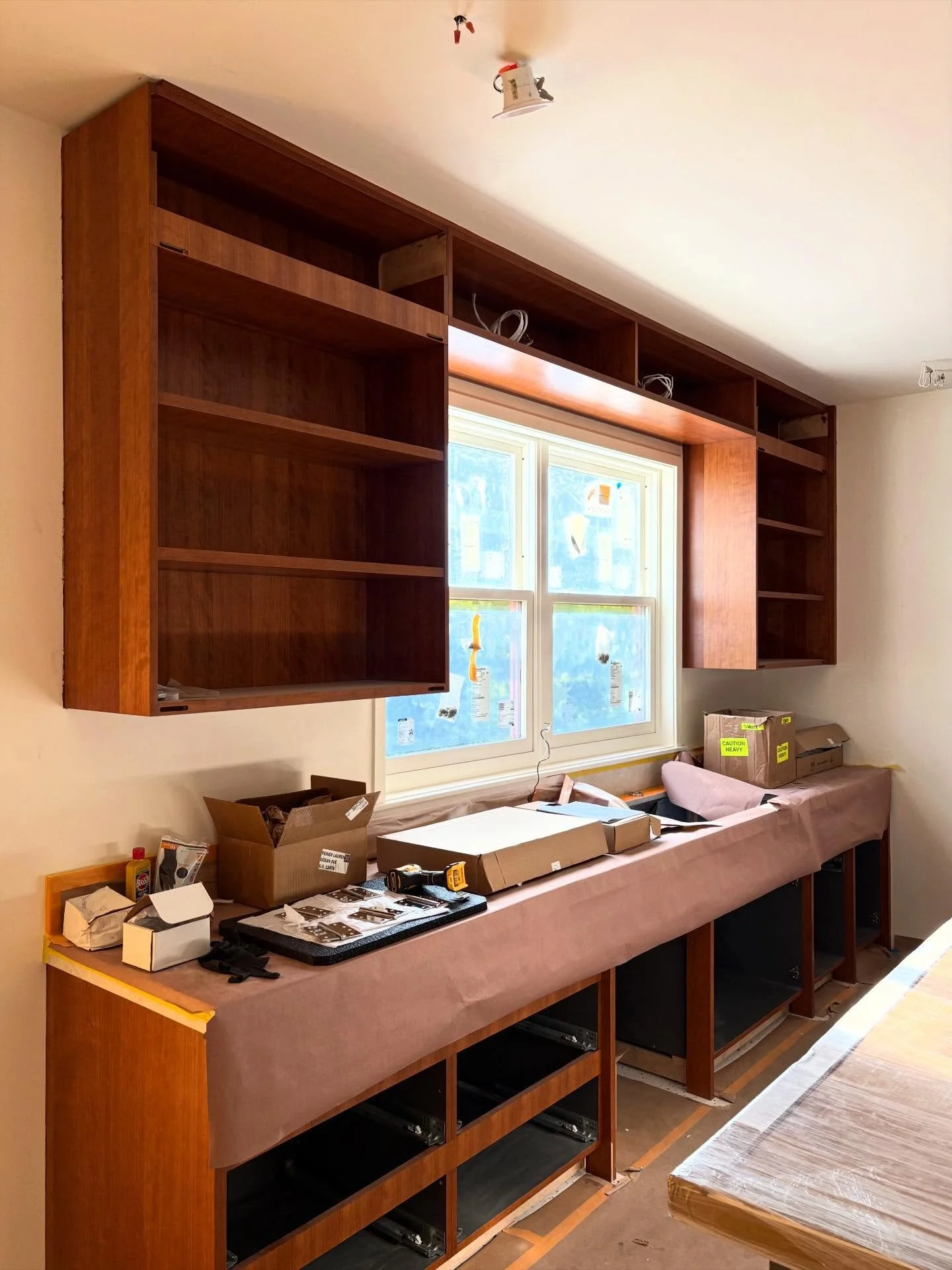 Cherry 🍒 cabinets with @rubiomonocoatusa finish for our Santa☀️🌊Monica project with @salice.official Air Hinges and beveled finger pulls are installed and ready for finished fronts! 🙌🏼