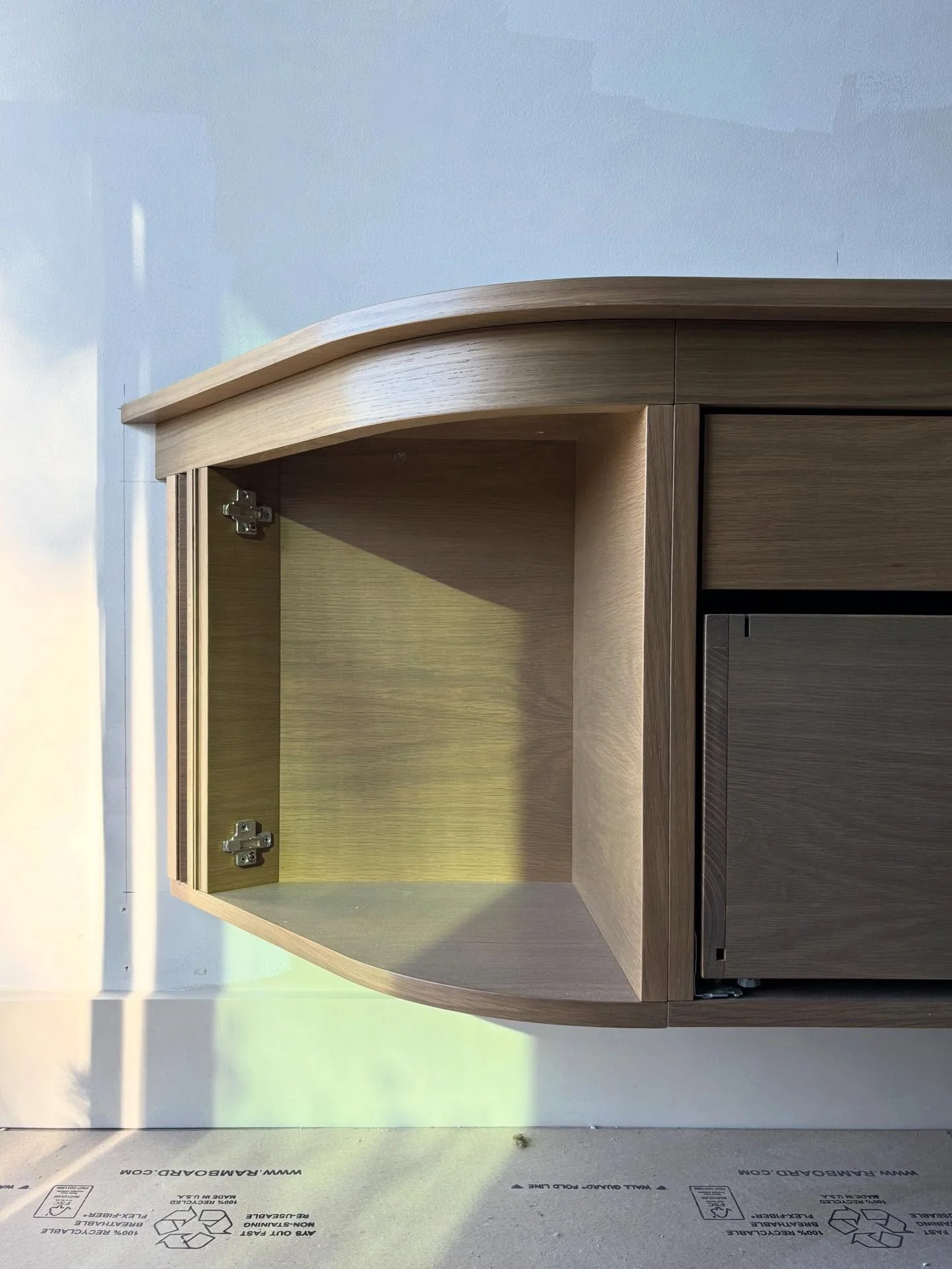 Floating stained White Oak Office📚🕰️ cabinet with radius ends and file drawers overlooking the Pacific ☀️ 🌊 

Radius doors and drawer fronts coming soon! 🔜