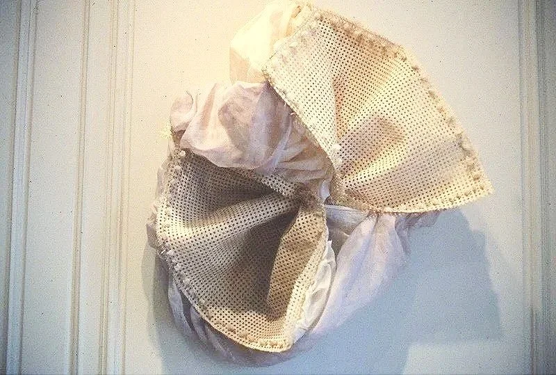 Chaperone, caning and cloth, 44 x 34 x 18"