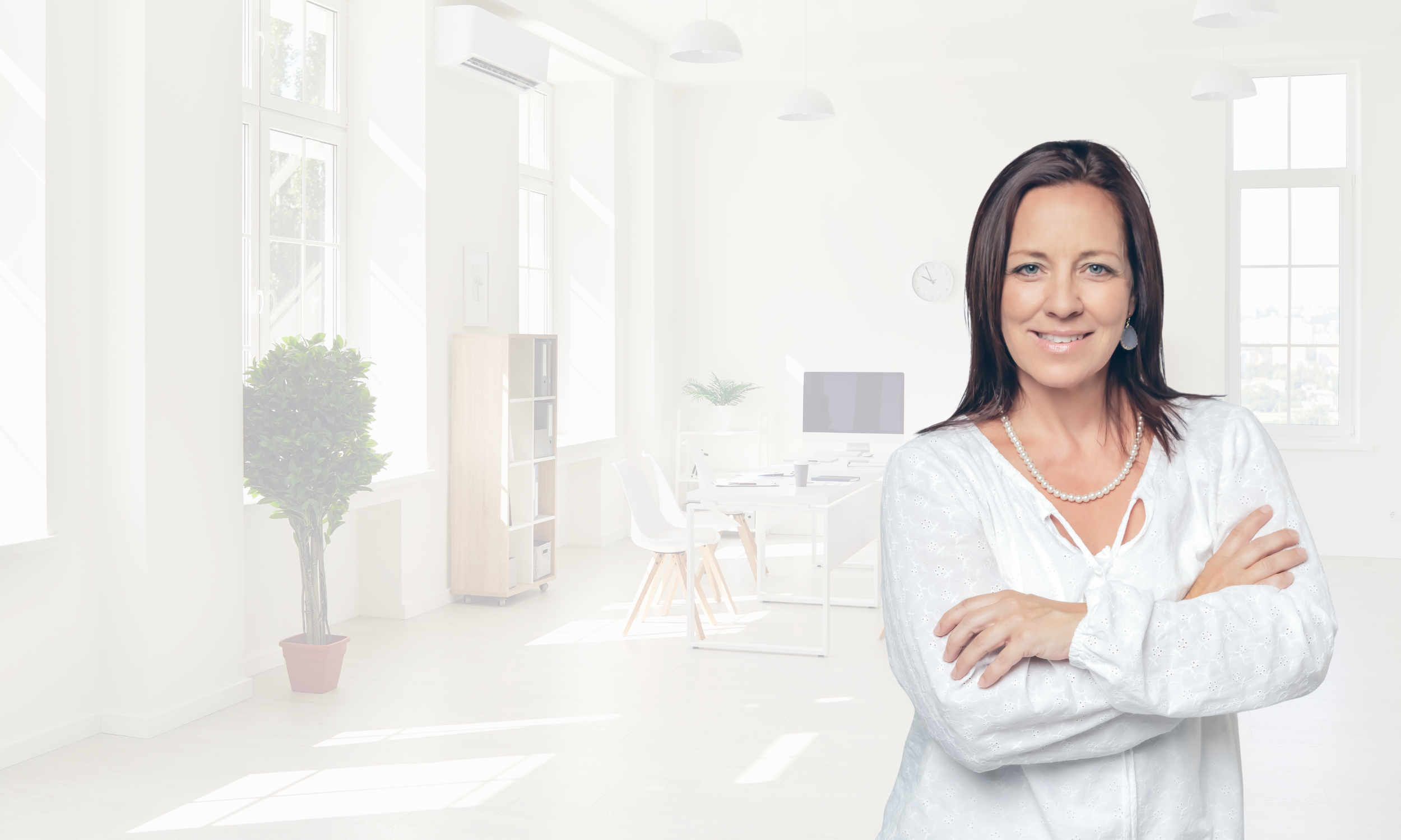 Amy McCae posing in a tech office for her executive coaching and speaking on emotional intelligence, mindfulness, well-being, and mindfulness